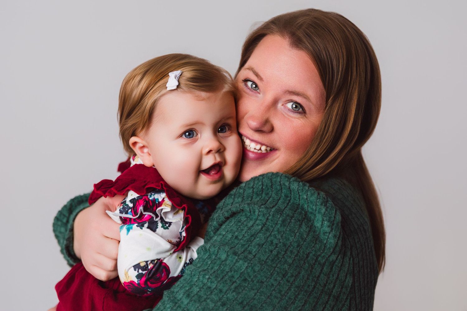 Intimate family moment captured in studio photography session.