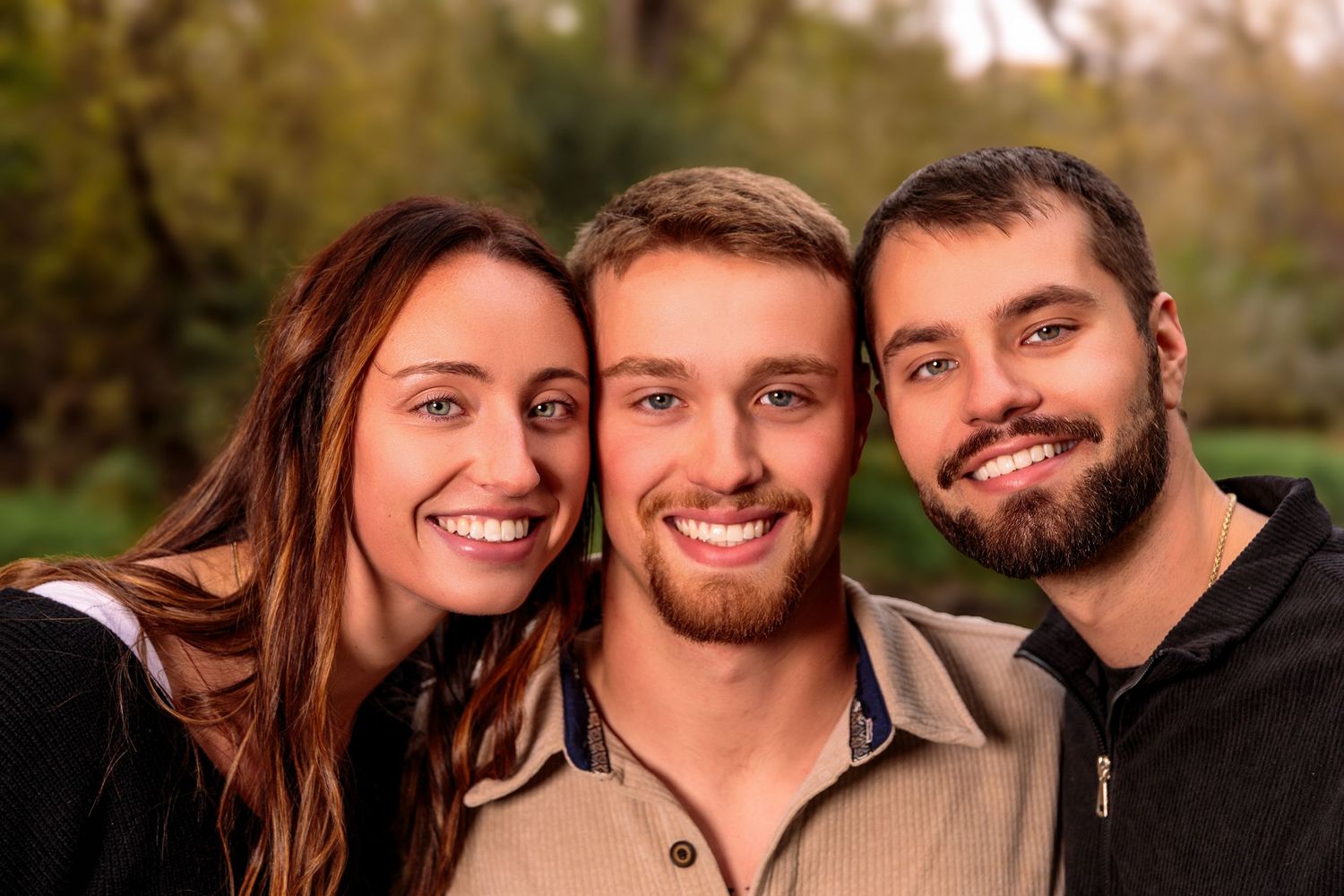Group portraits of adults in casual attire smiling against an autumn outdoor backdrop.