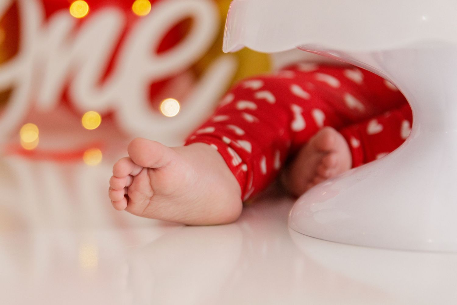 Close-up view of birthday decorations with soft bokeh lighting effects.