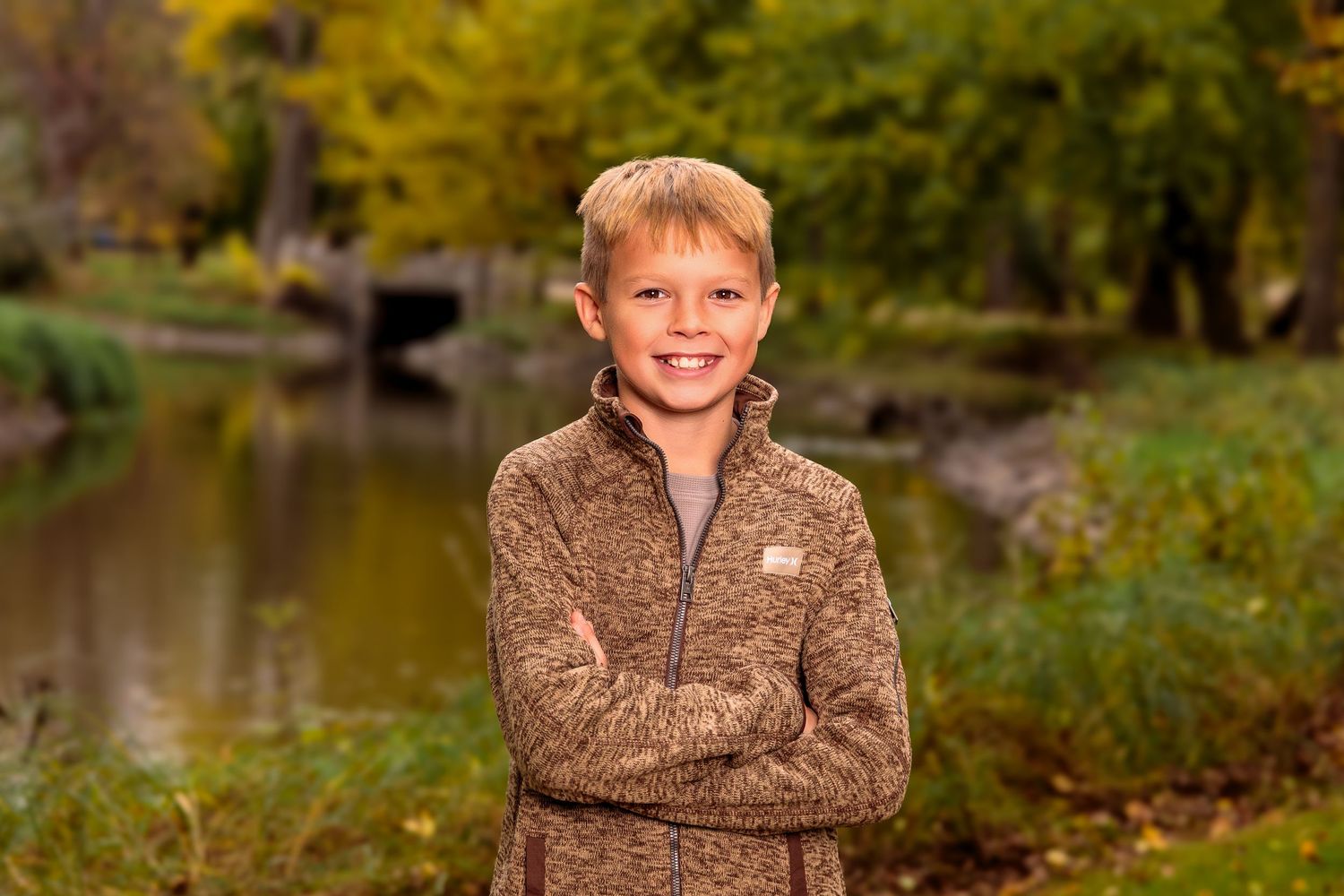 Fall outdoor portraits in nature with autumn colors and foliage in the background.