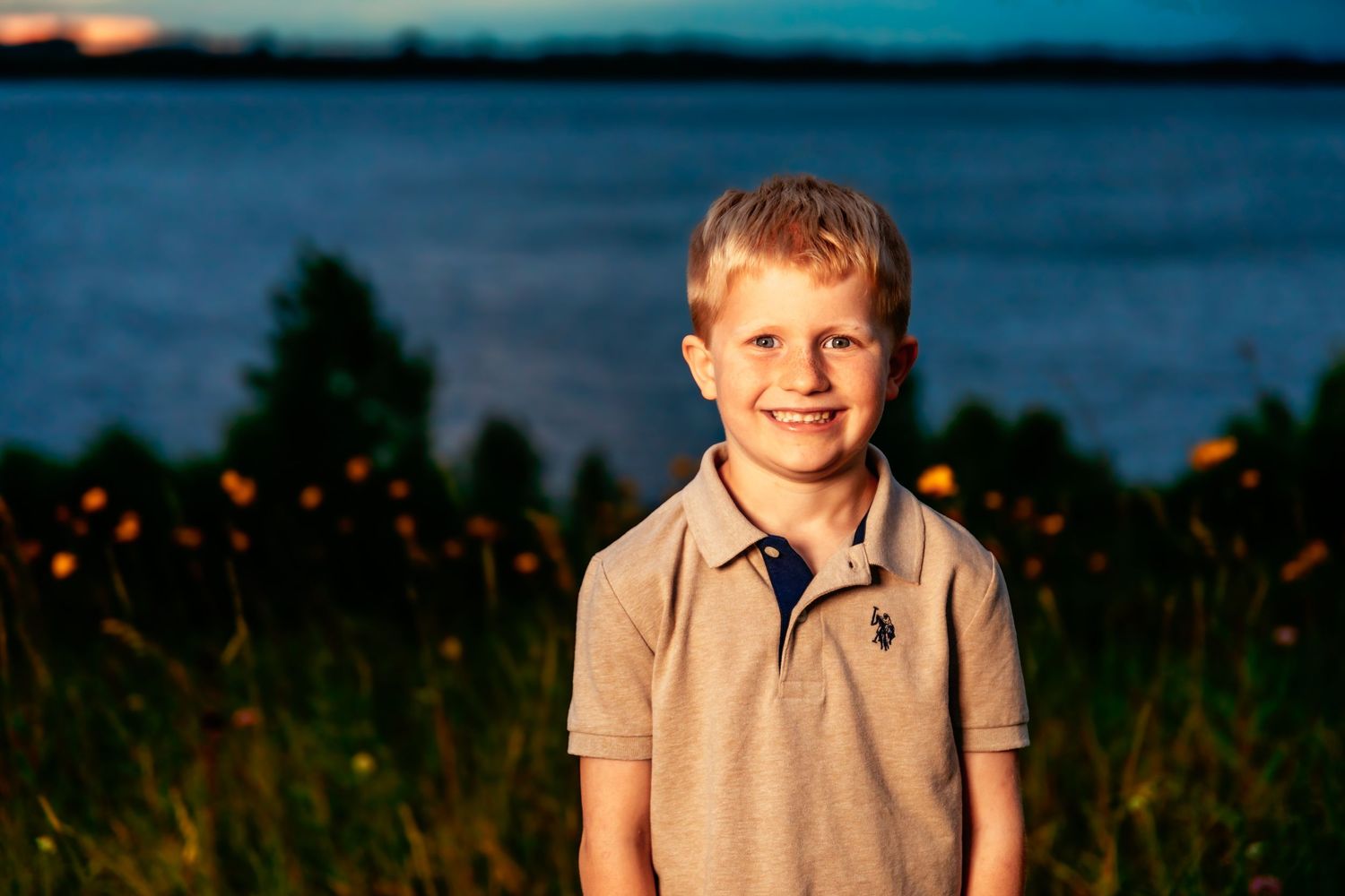 Series of seven outdoor sunset portraits showing a young child's joyful expressions.