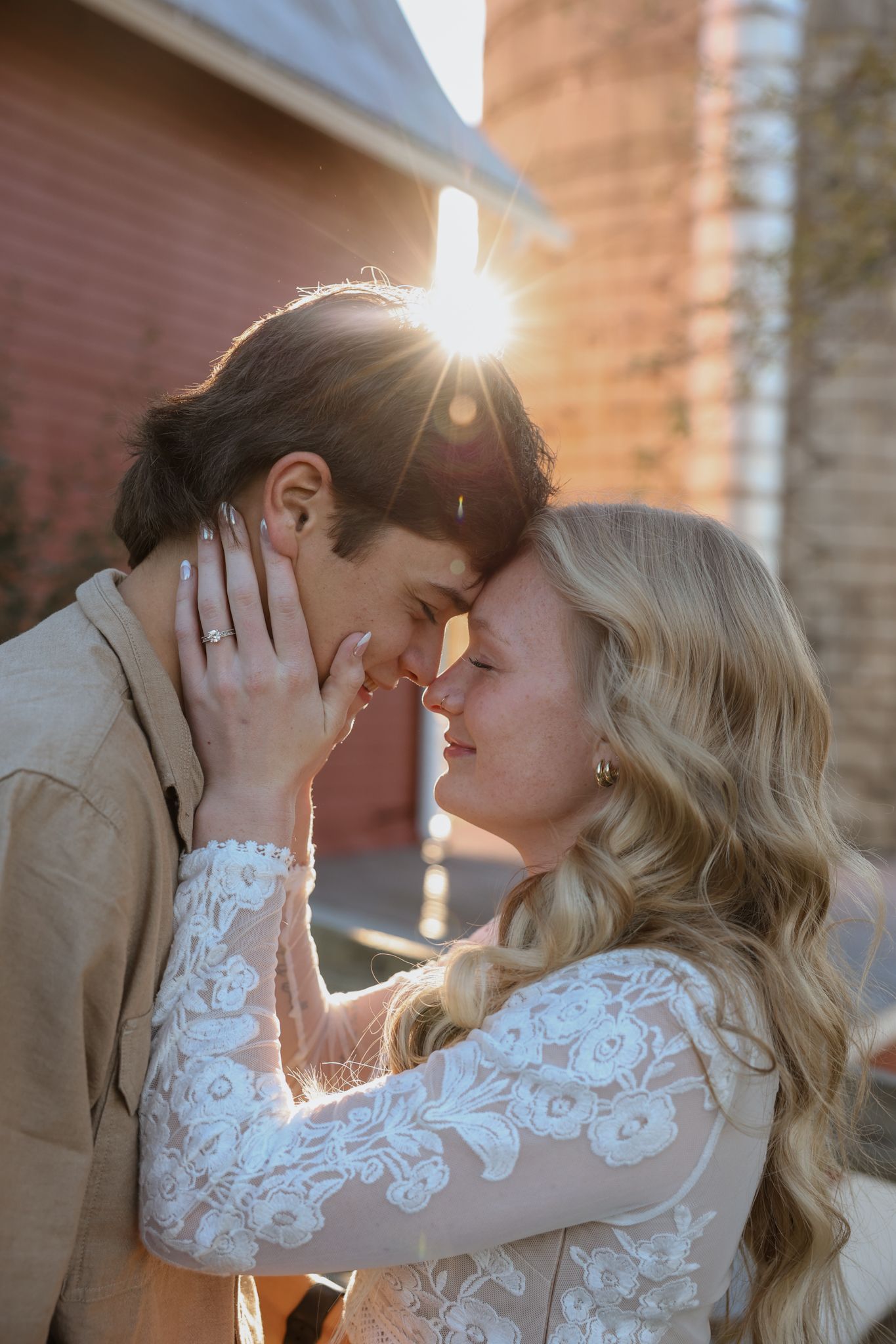 A romantic wedding couple shares intimate kisses in a series of sunlit portraits against a brick wall.