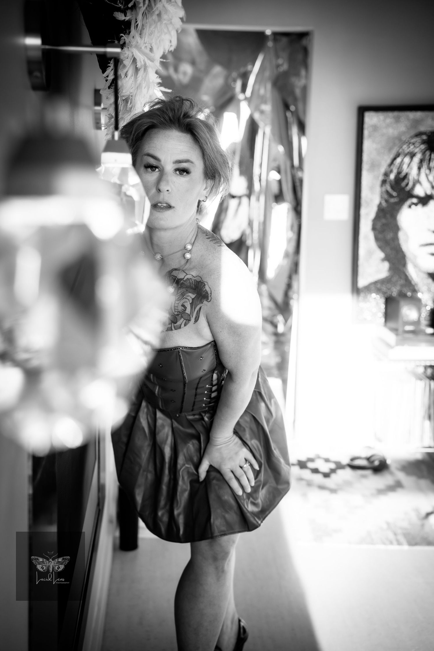 A series of black and white artistic portraits showing a figure in dark clothing against a light background.