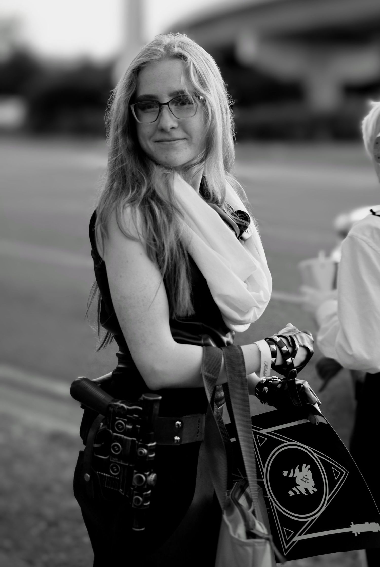Black and white street portrait of a woman in Pensacola, Florida—timeless documentary-style by Photography by Rachel.