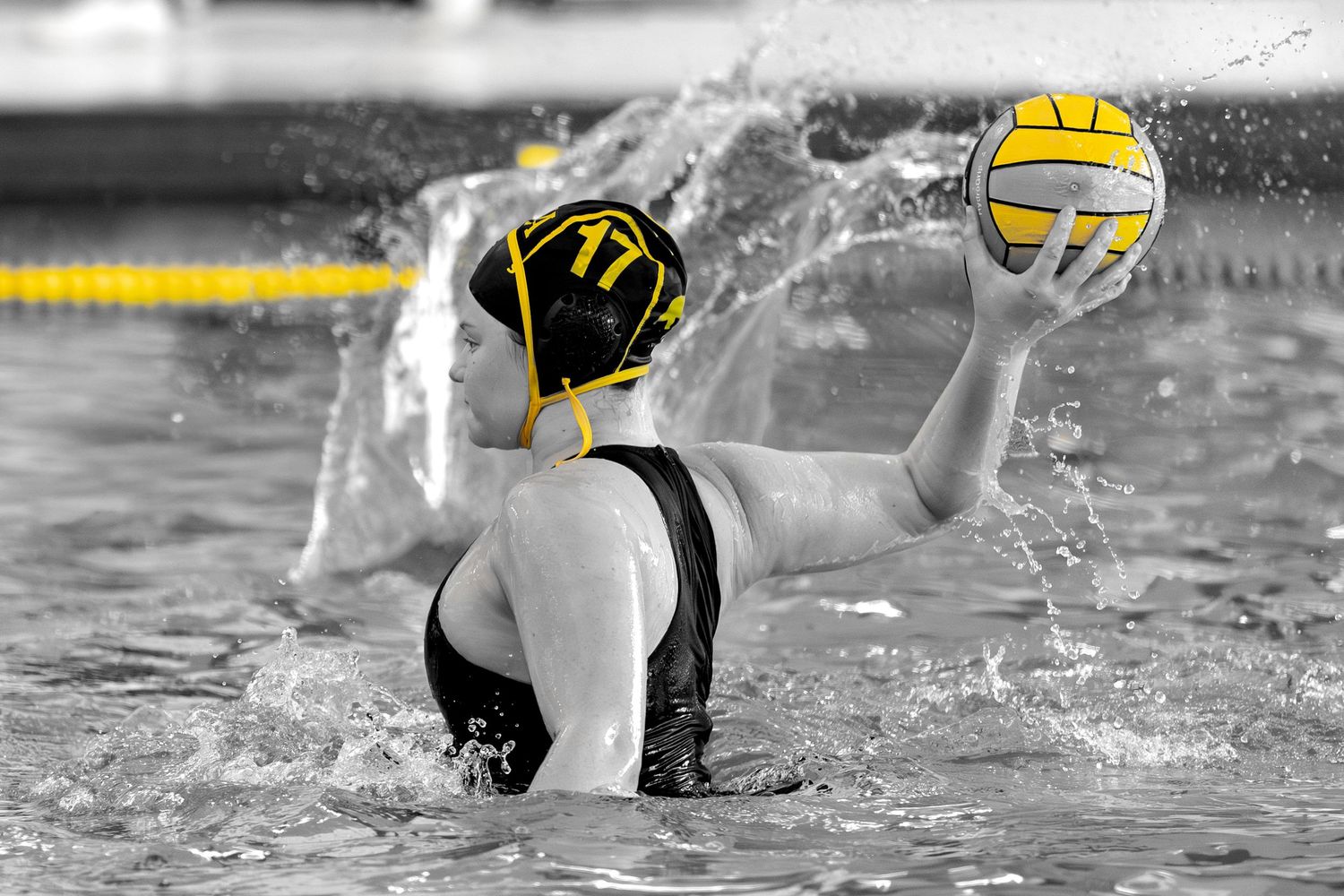 Black and white action sequence showing water polo players competing in a swimming pool during a match.