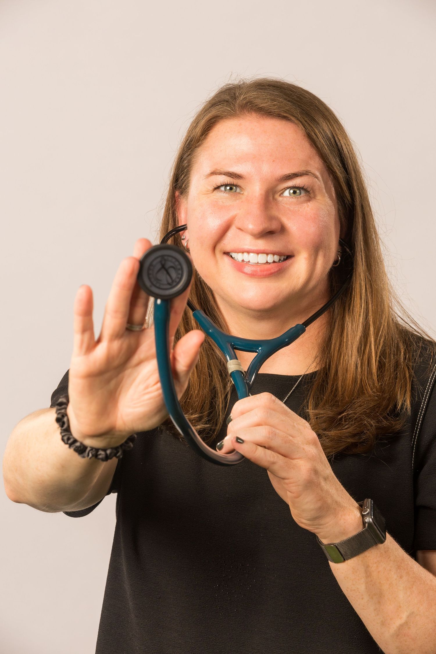 Dynamic poses showing medical professional handling stethoscope with enthusiasm.