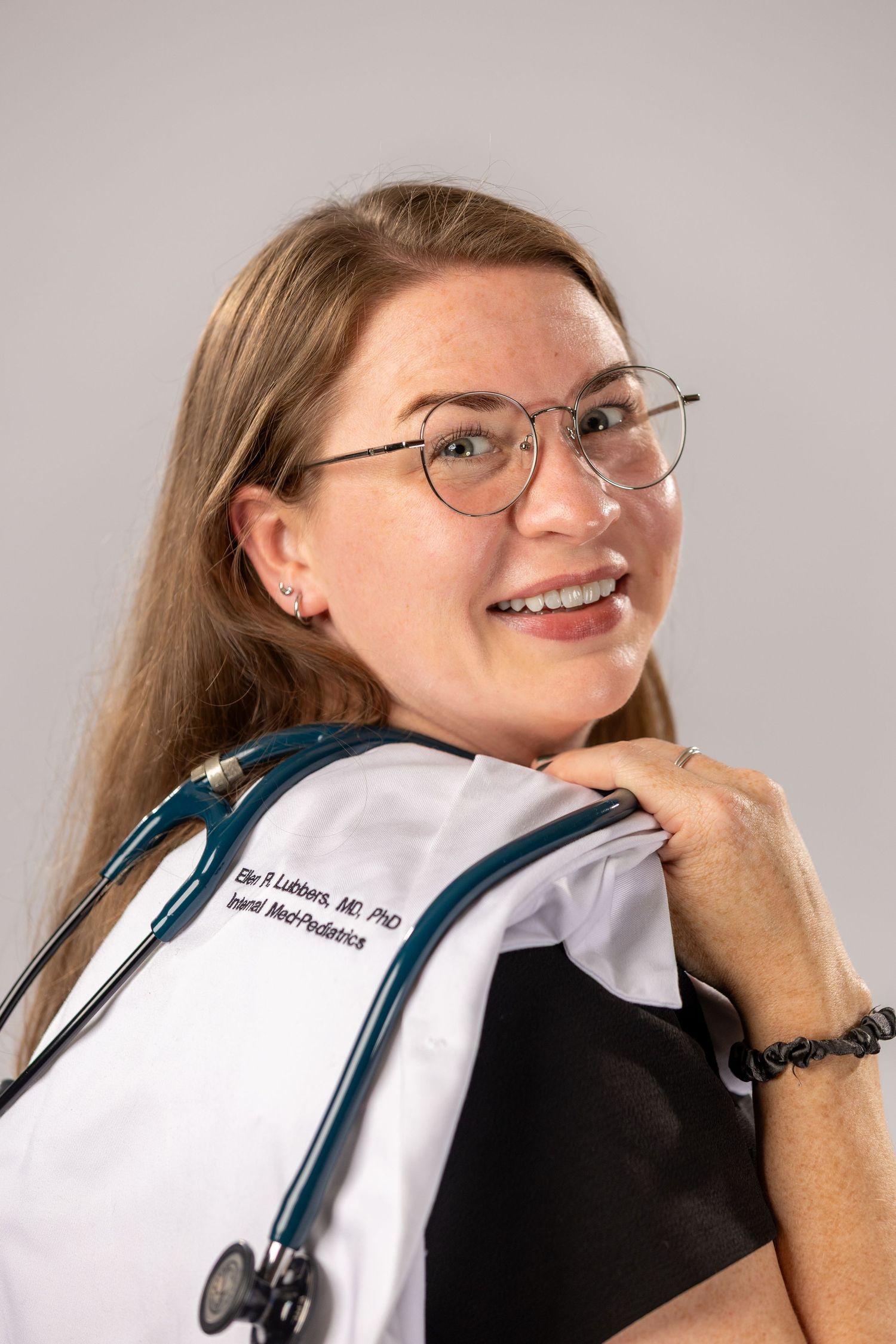Series showing someone in medical attire posing with hand under chin.