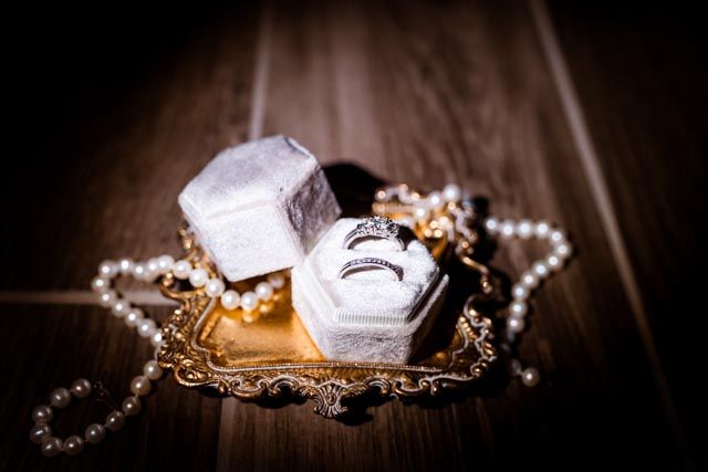 A sequence of romantic engagement ring photos with pearls and decorative elements in dramatic lighting.