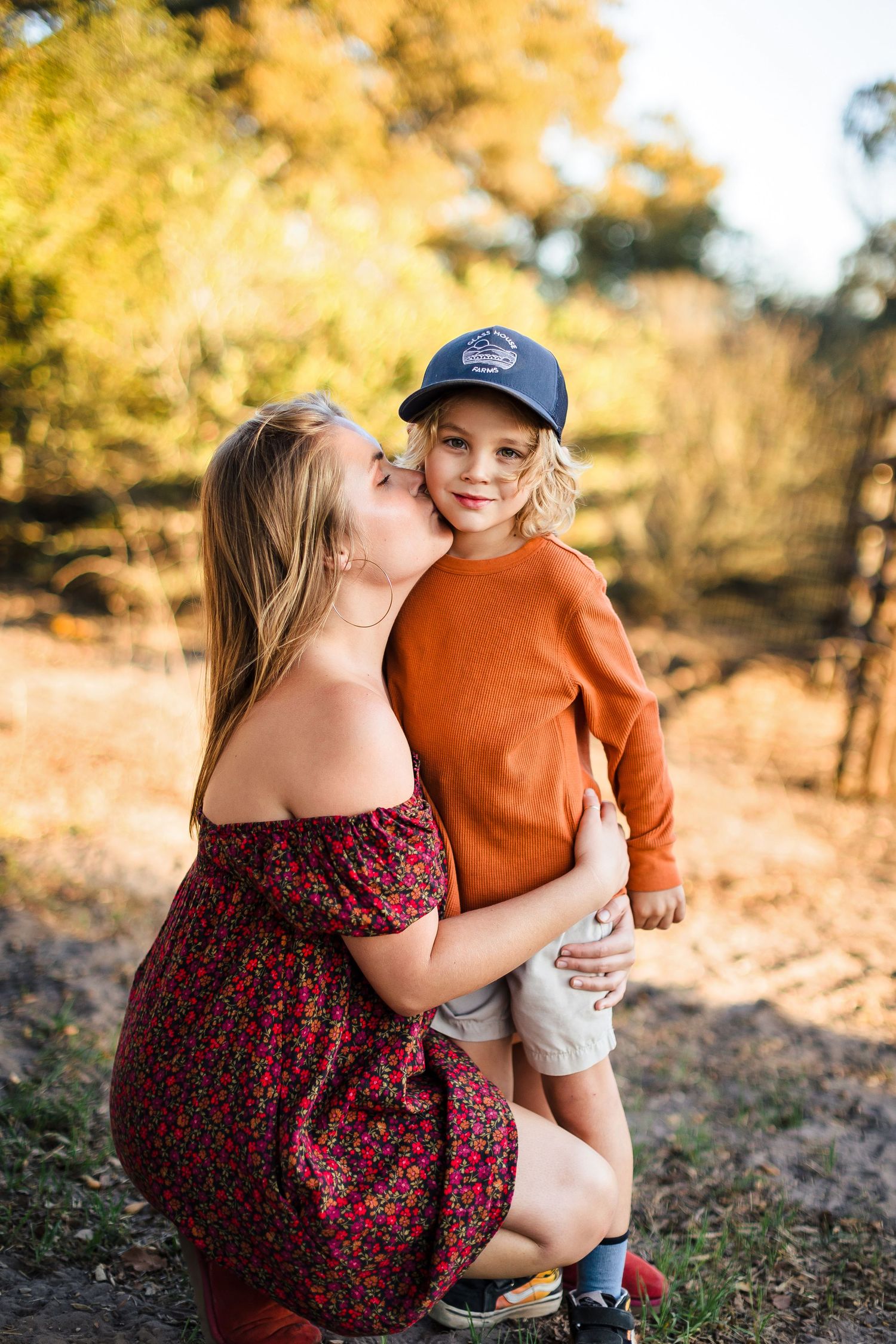 A heartwarming outdoor photo sequence showing affectionate moments in golden autumn sunlight.