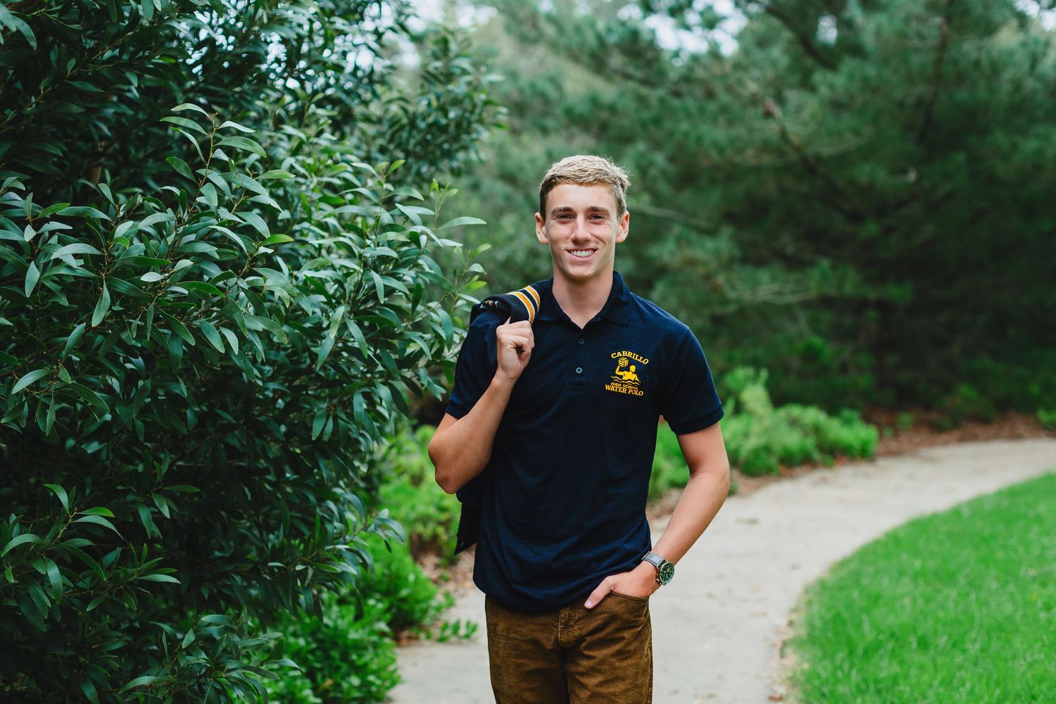 A series of outdoor portraits taken in a lush green park setting with winding paths and natural lighting.
