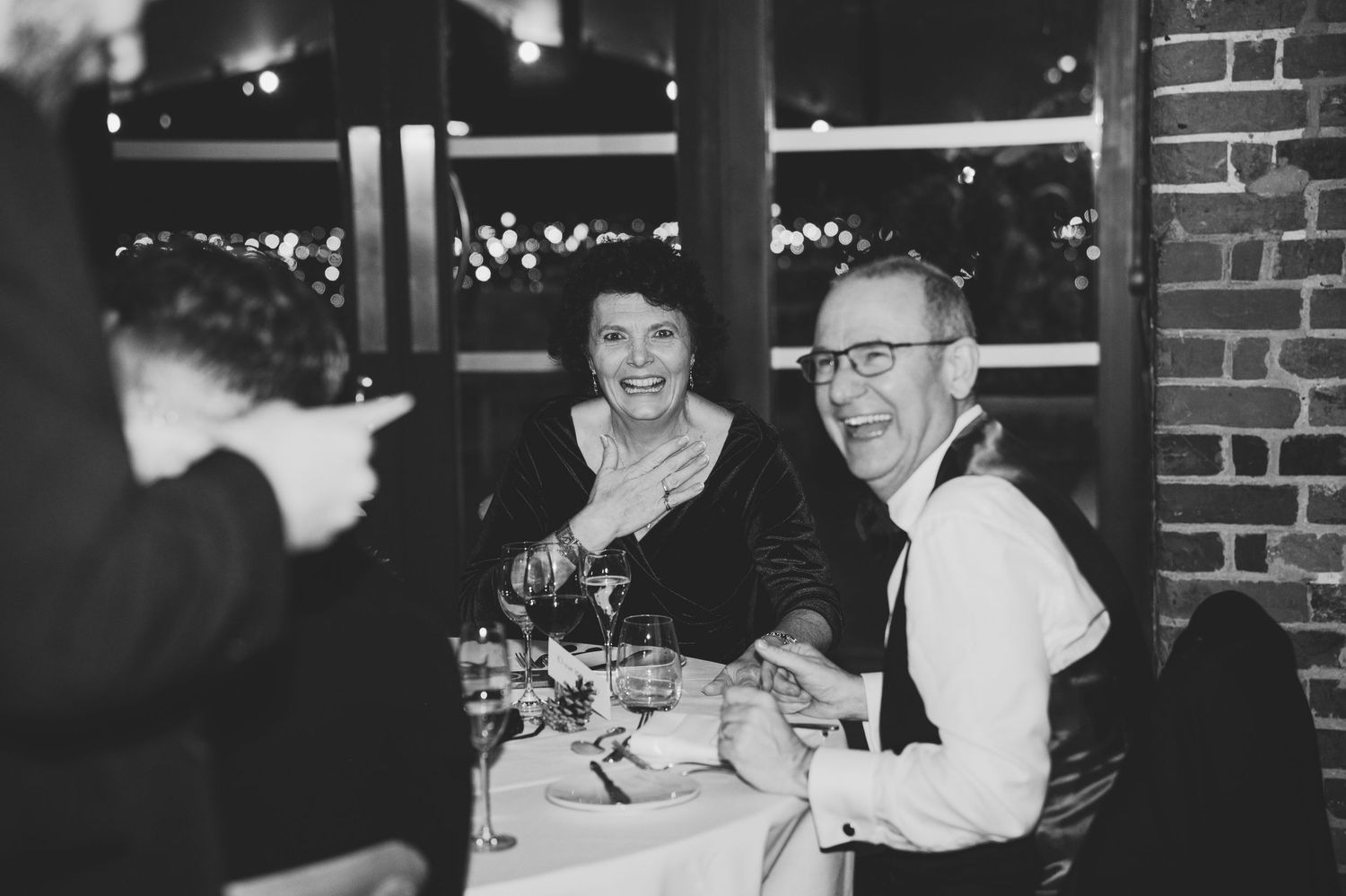 A collection of vintage black and white photographs showing people dining and socializing at a restaurant or cafe.