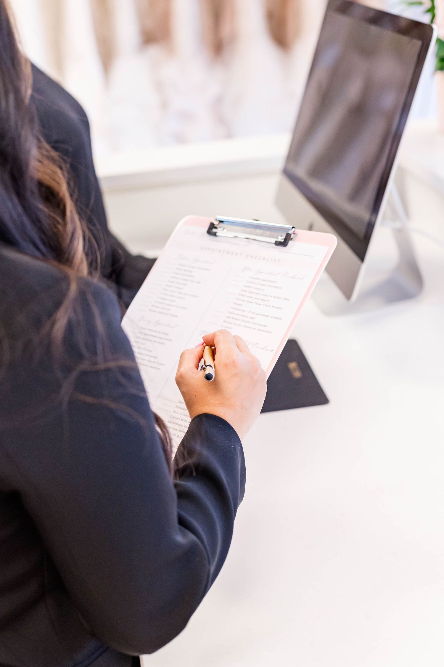 GIRL LOOKING AT CLIPBOARD