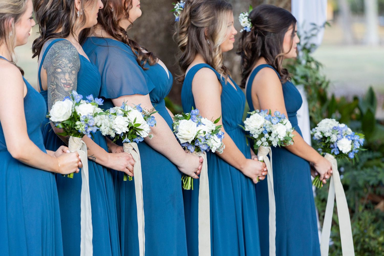 bridesmaids standing in a row