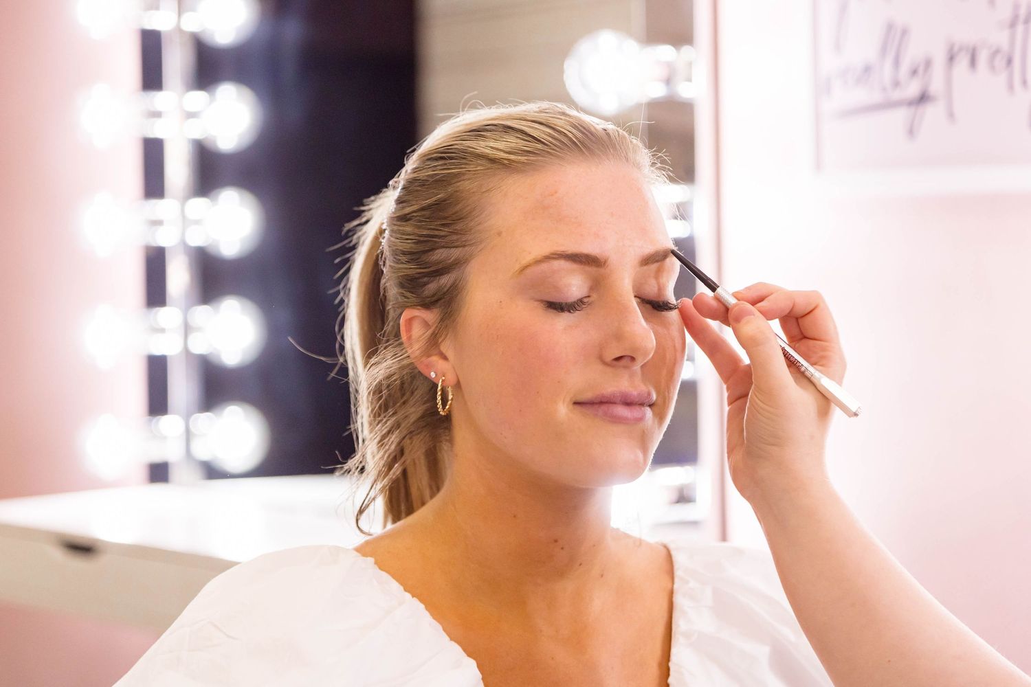 GIRL HAVING MAKEUP APPLIED
