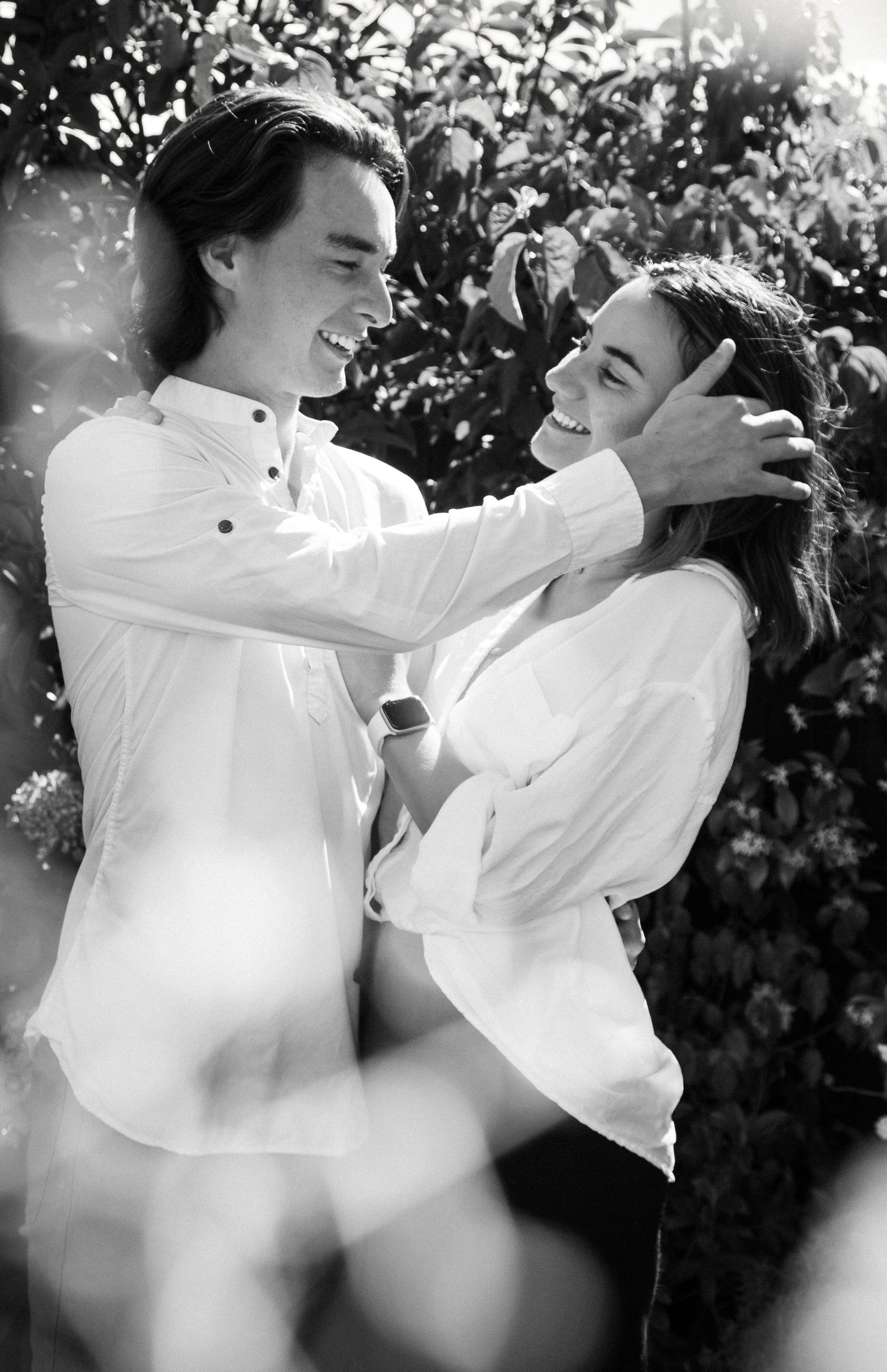 Loved up and engaged, black and white candid engagement photo shoot