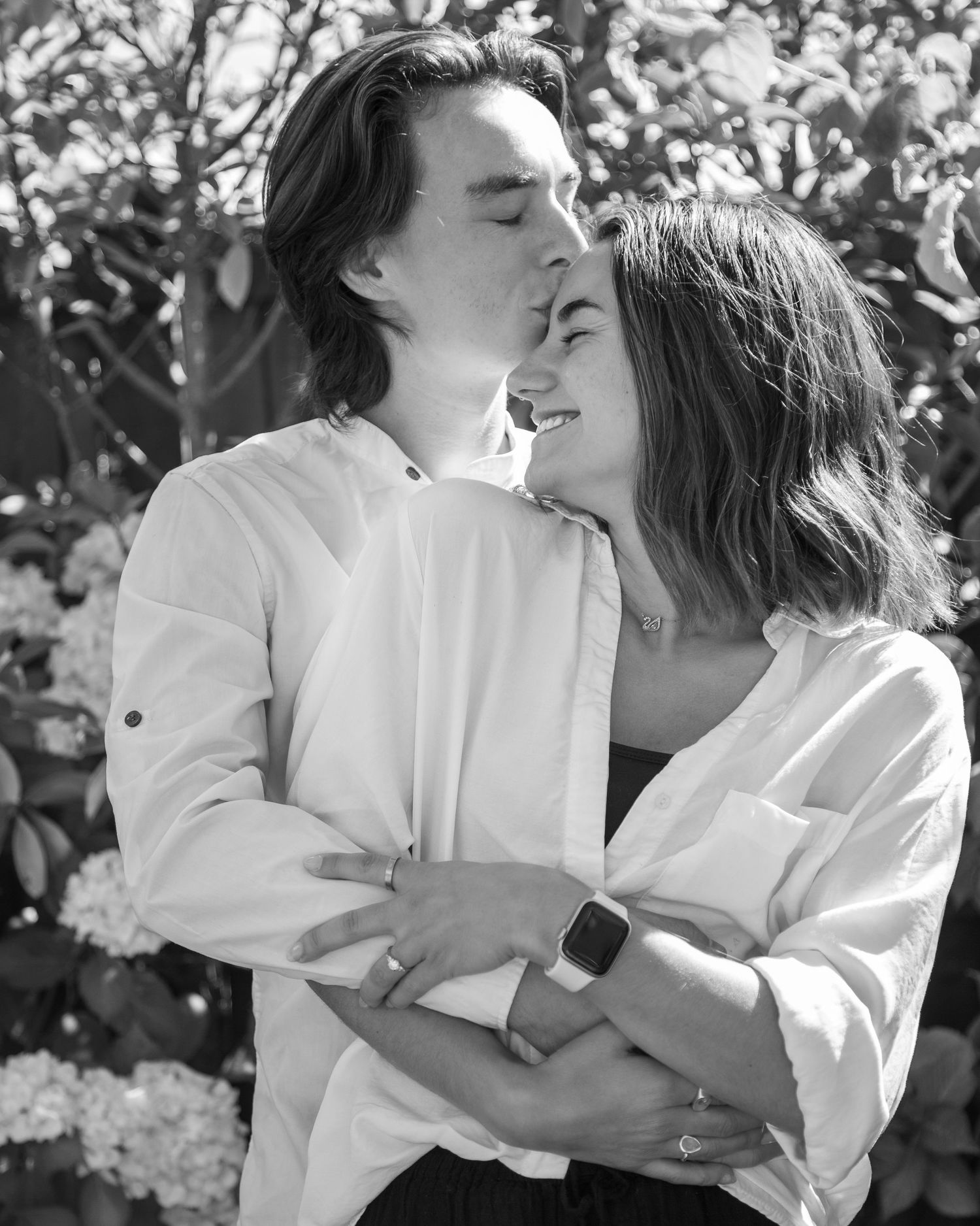 Loved up and engaged, black and white candid engagement photo shoot