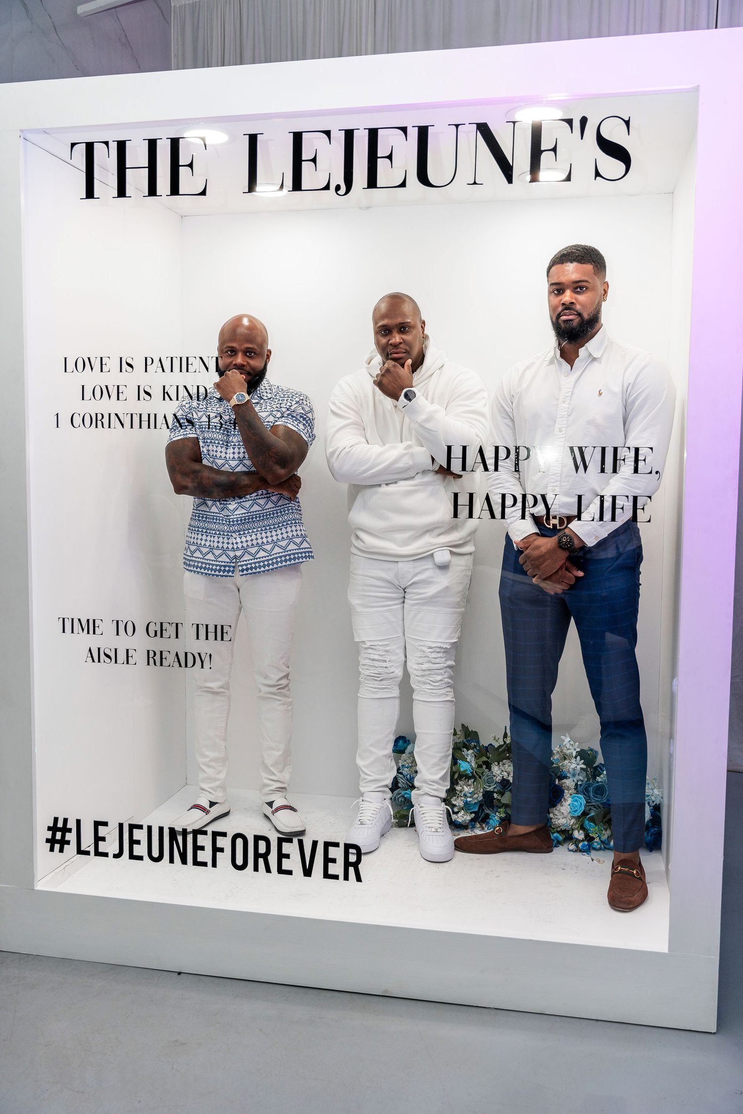 Three well-dressed men pose seriously inside The Lejeunes Happy Wife Happy Life decorative photo frame display.