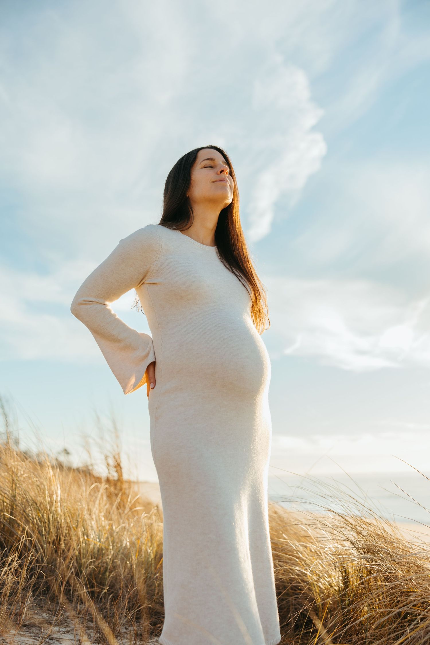 Beach maternity session at Cape May NJ photographed by a South Jersey maternity photographer serving Cherry Hill and Philadelphia.