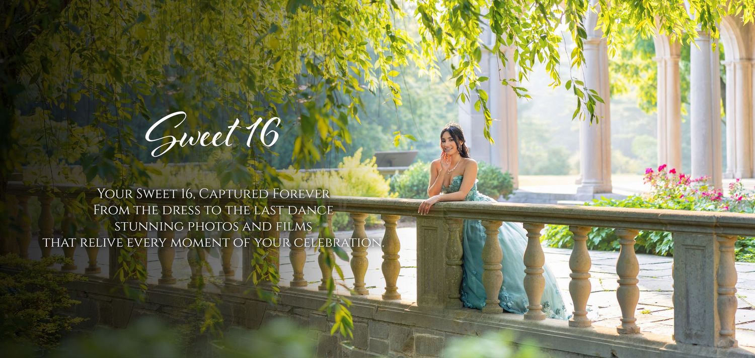 A young woman in an elegant teal gown poses on a stone balcony surrounded by lush greenery at a Sweet 16 photoshoot.