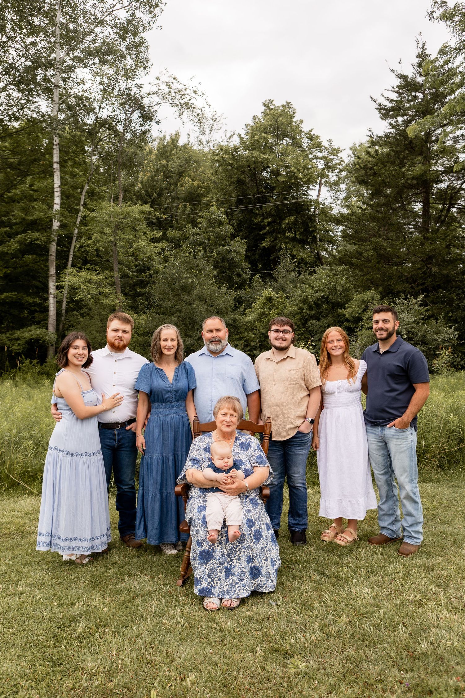 Extended family gathered in park in shades of blue and white in Columbus Ohio