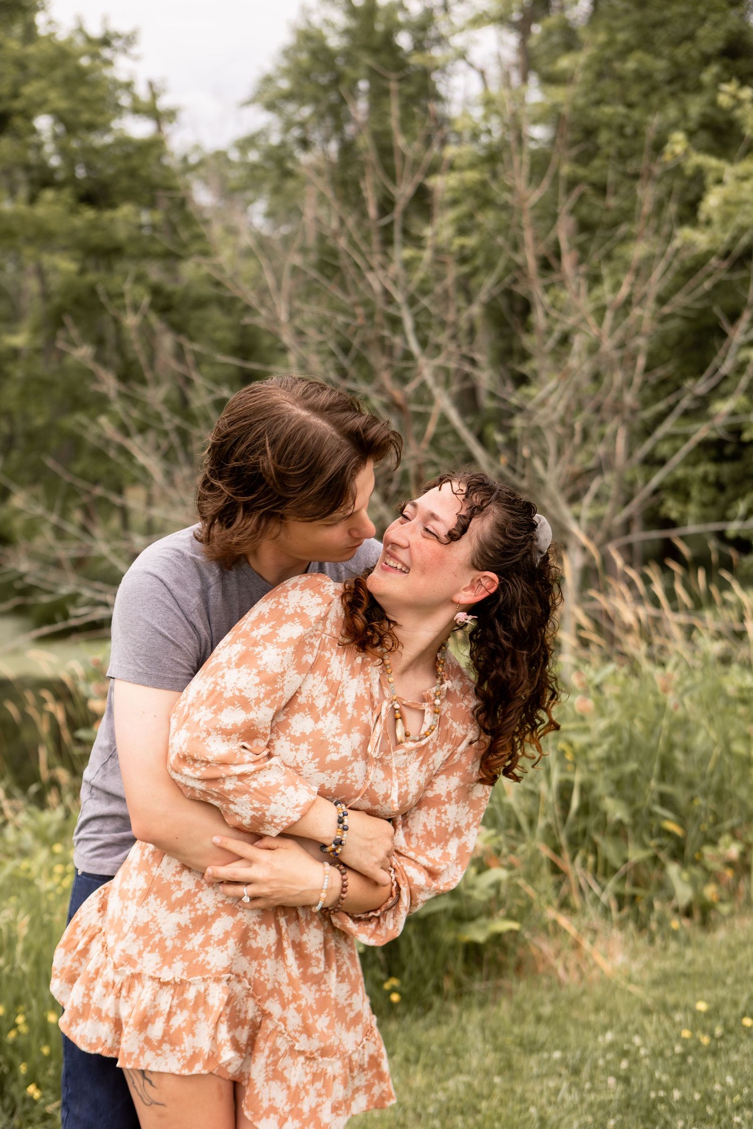 Couple hugging and laughing in nature preserve in Columbus Ohio