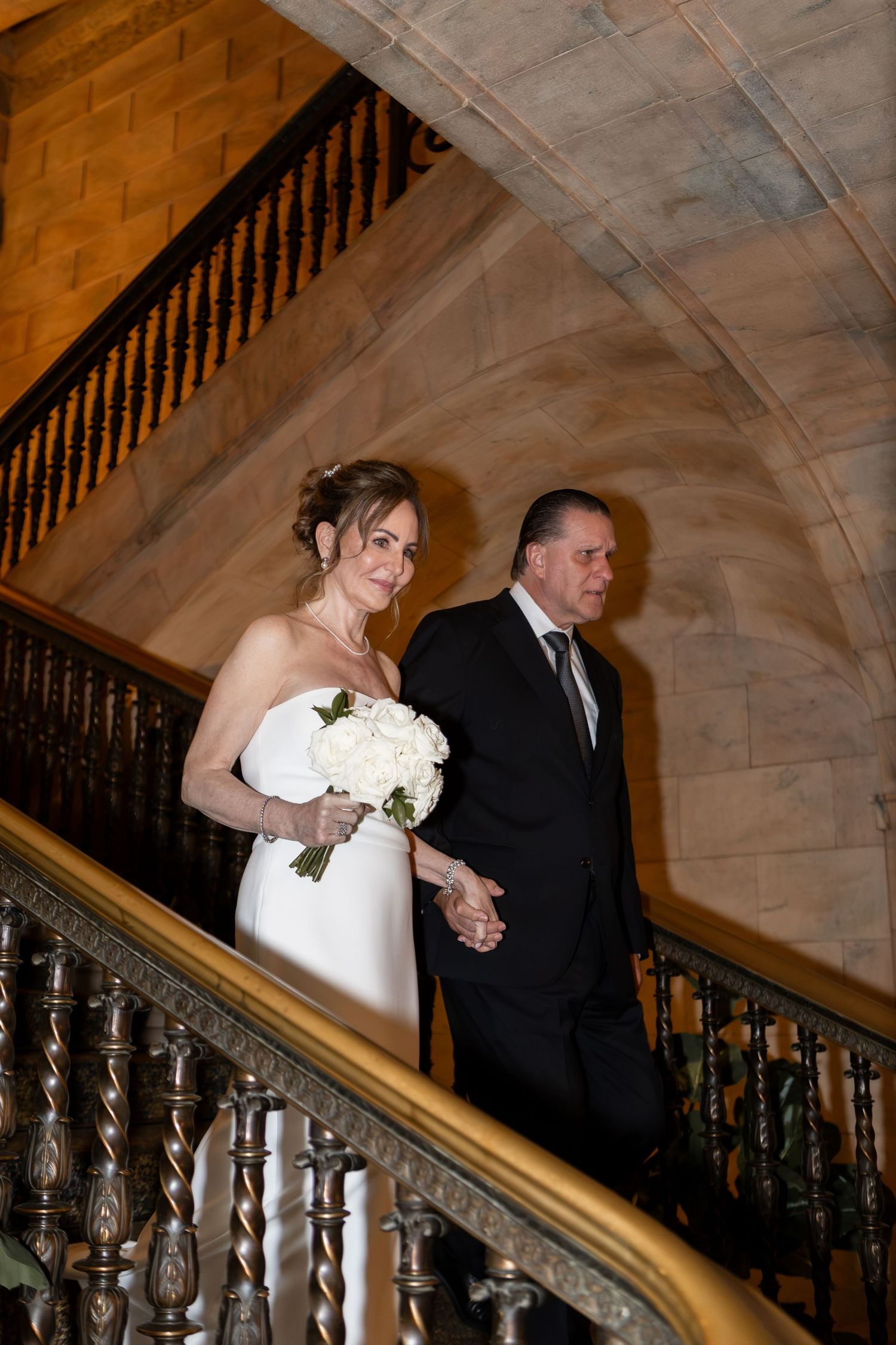 Bride and groom descending the stairs in Cleveland Ohio