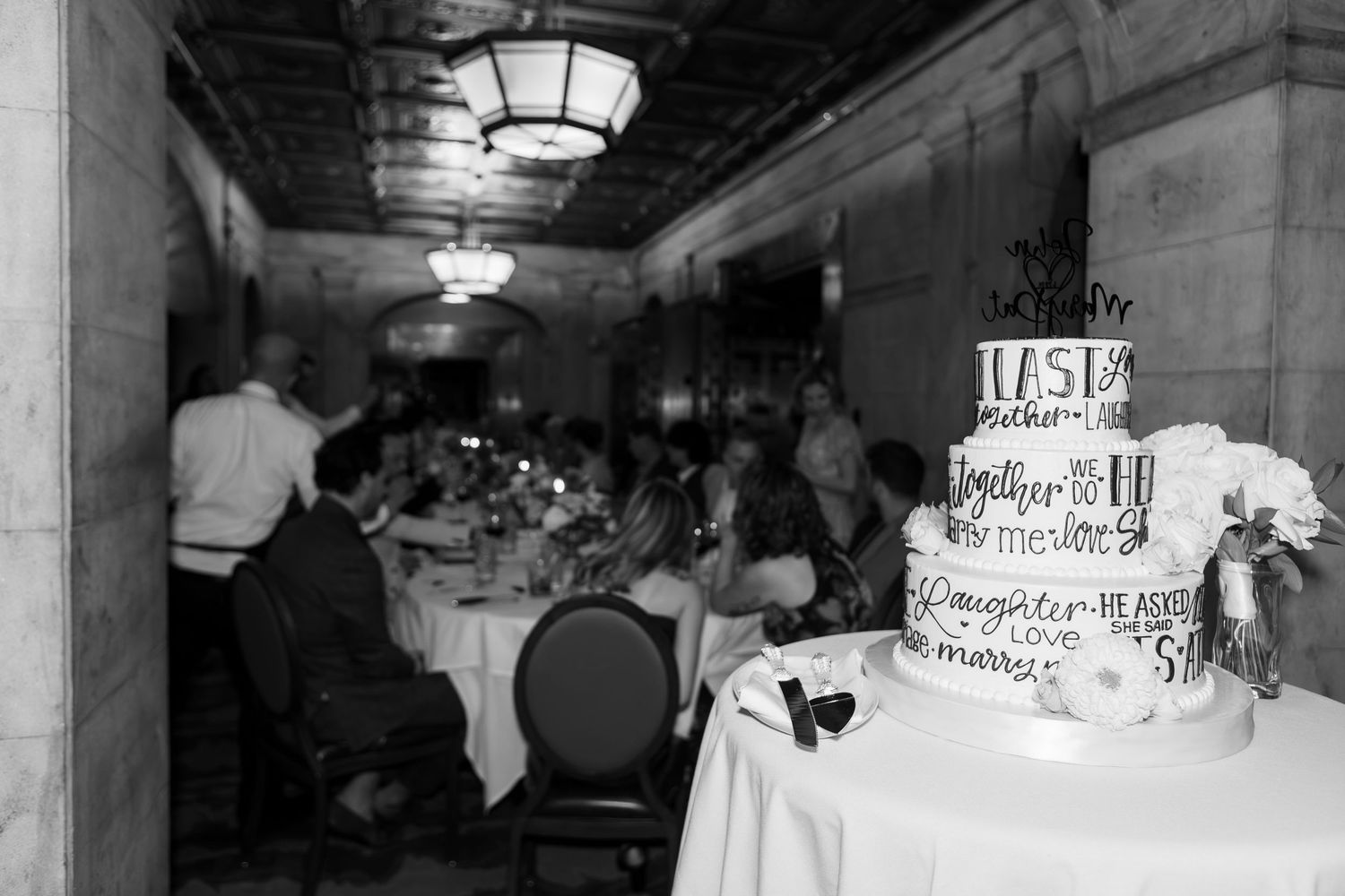 Black and white photos of wedding cake and reception in Ohio