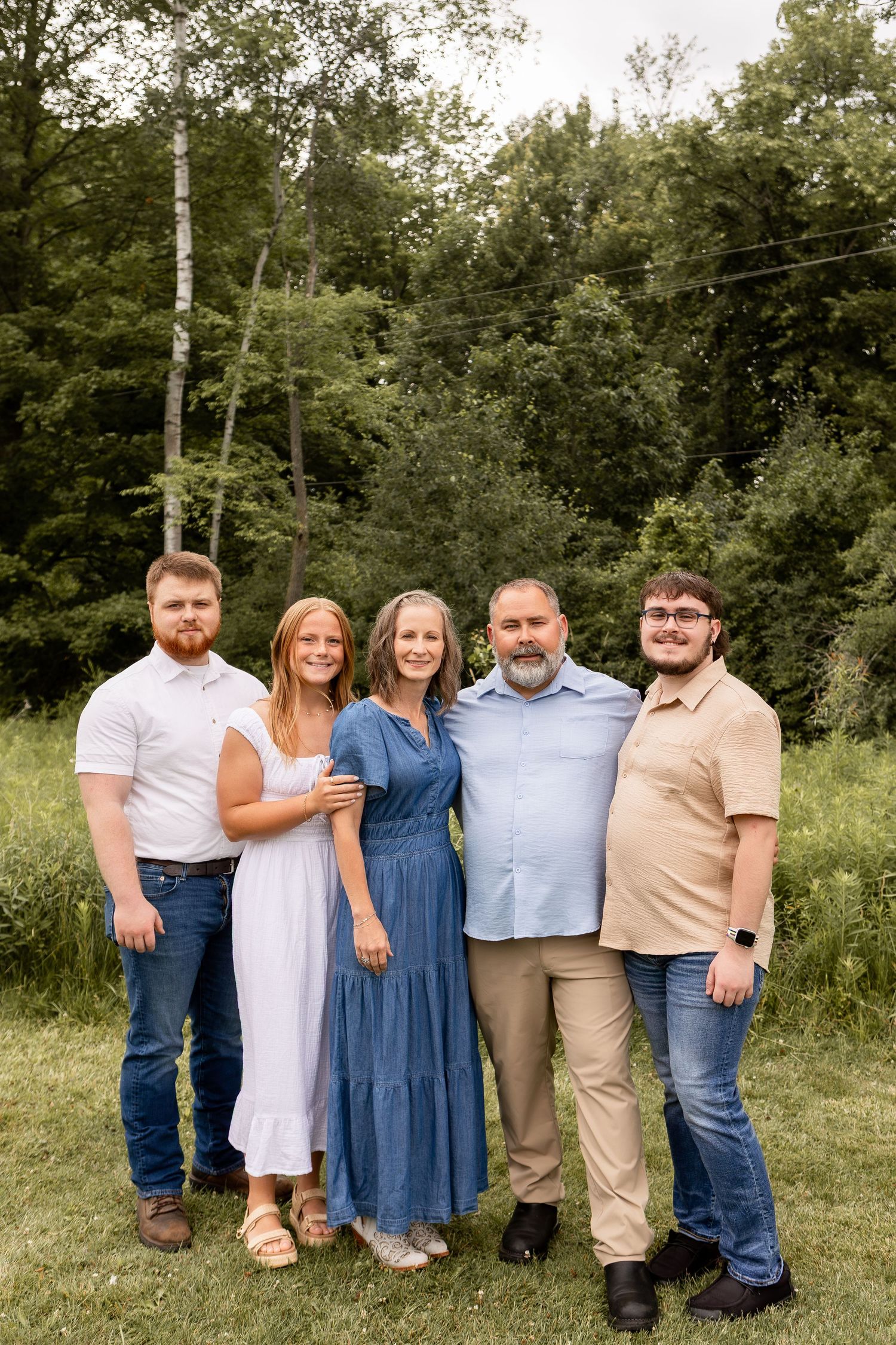 Family of five standing in park smiling in Columbus Ohio
