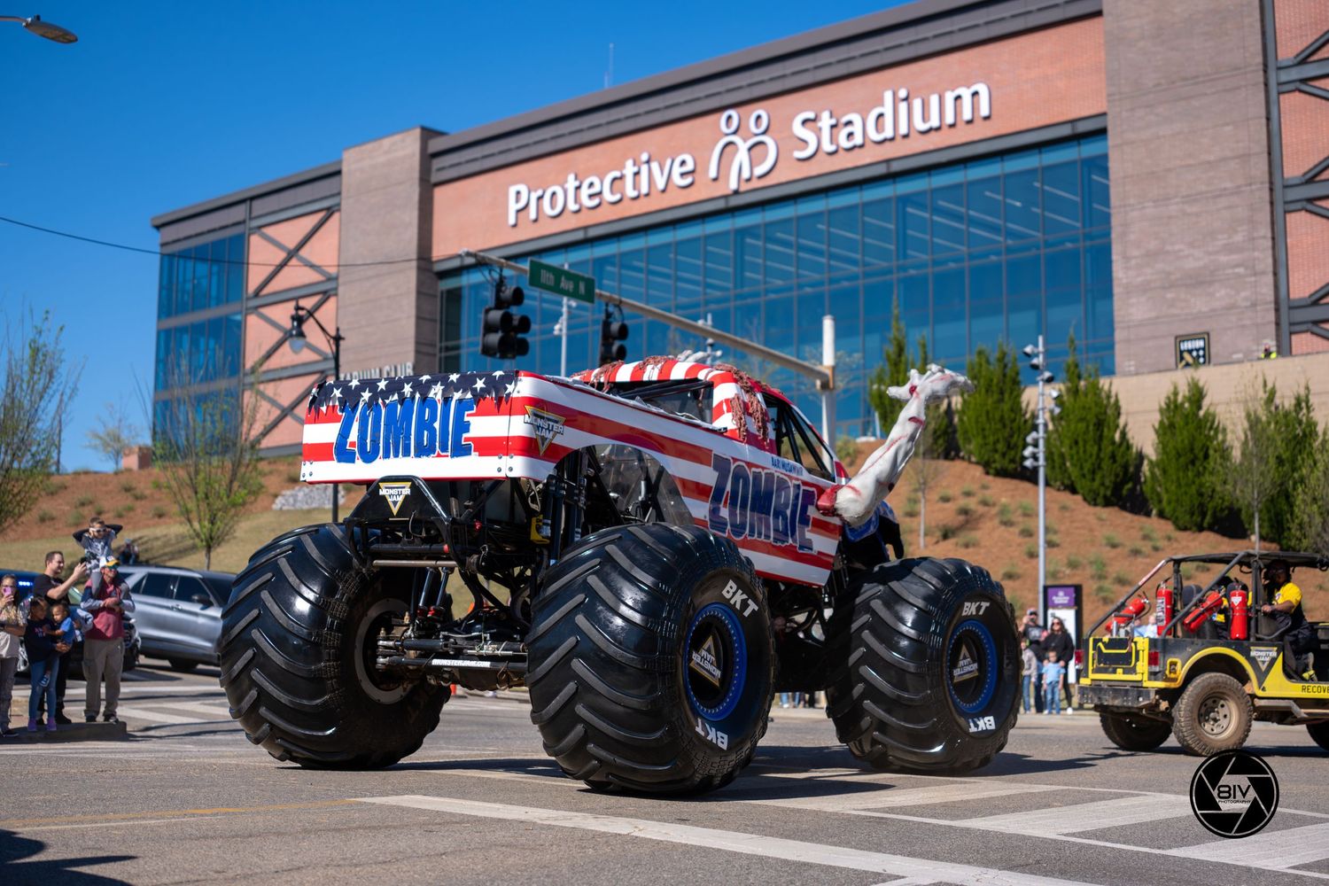 Zombie monster truck on display outside Protective Stadium on a sunny day.