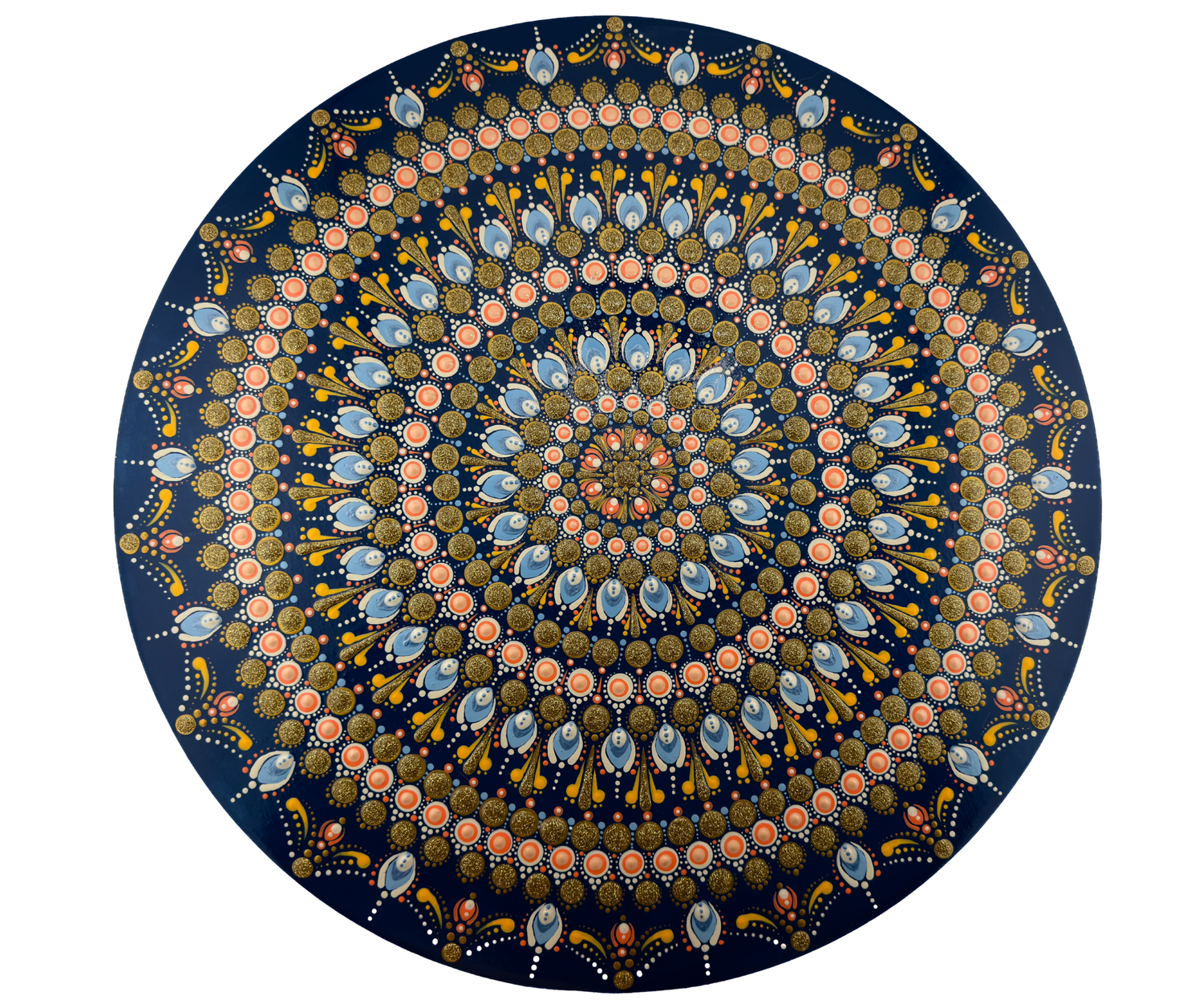 Intricate circular mandala art with concentric rings of blue, pink, and gold floral patterns on a dark navy background.