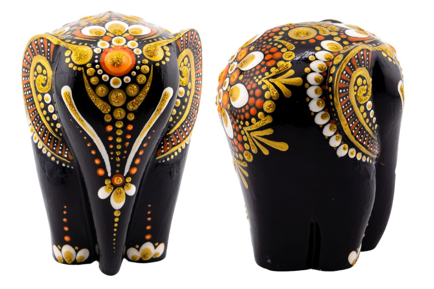 Black decorative elephant figurine with intricate gold, orange, and white dot art floral patterns, shown from front and back.