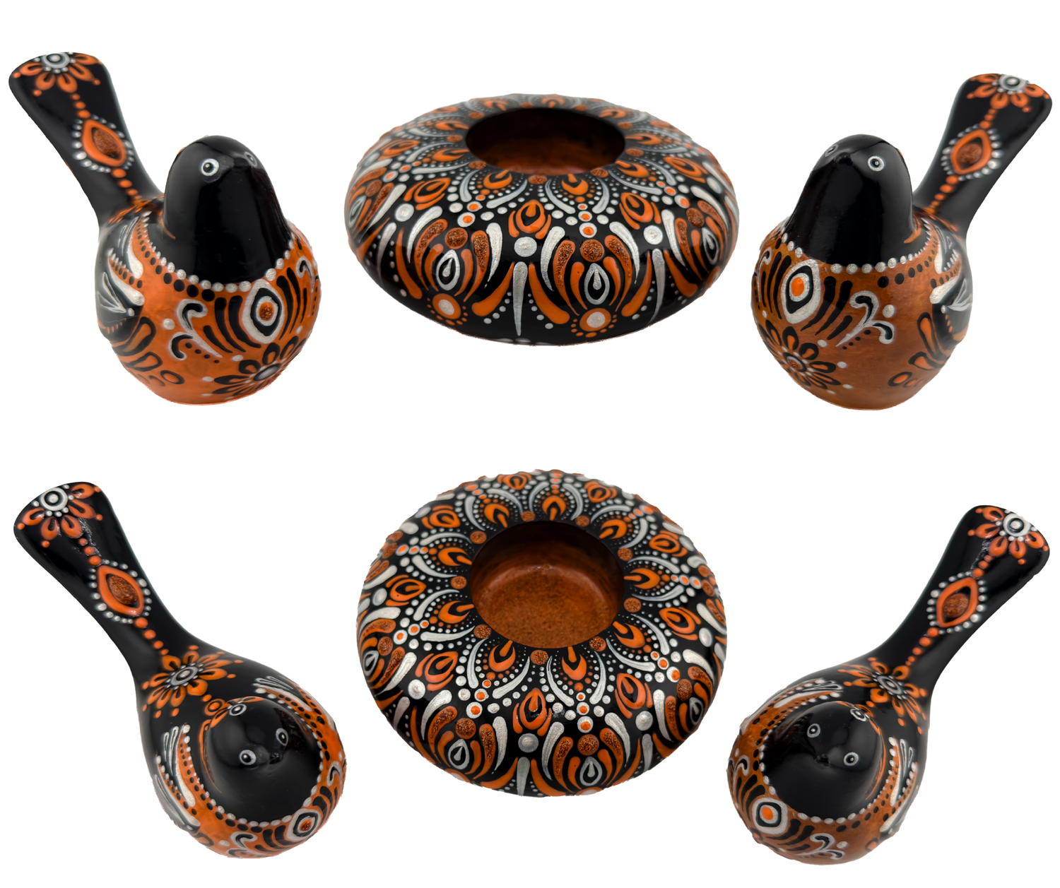 Hand-painted black and orange ceramic bird figurines and decorative bowl with intricate dot mandala patterns, traditional folk art style.