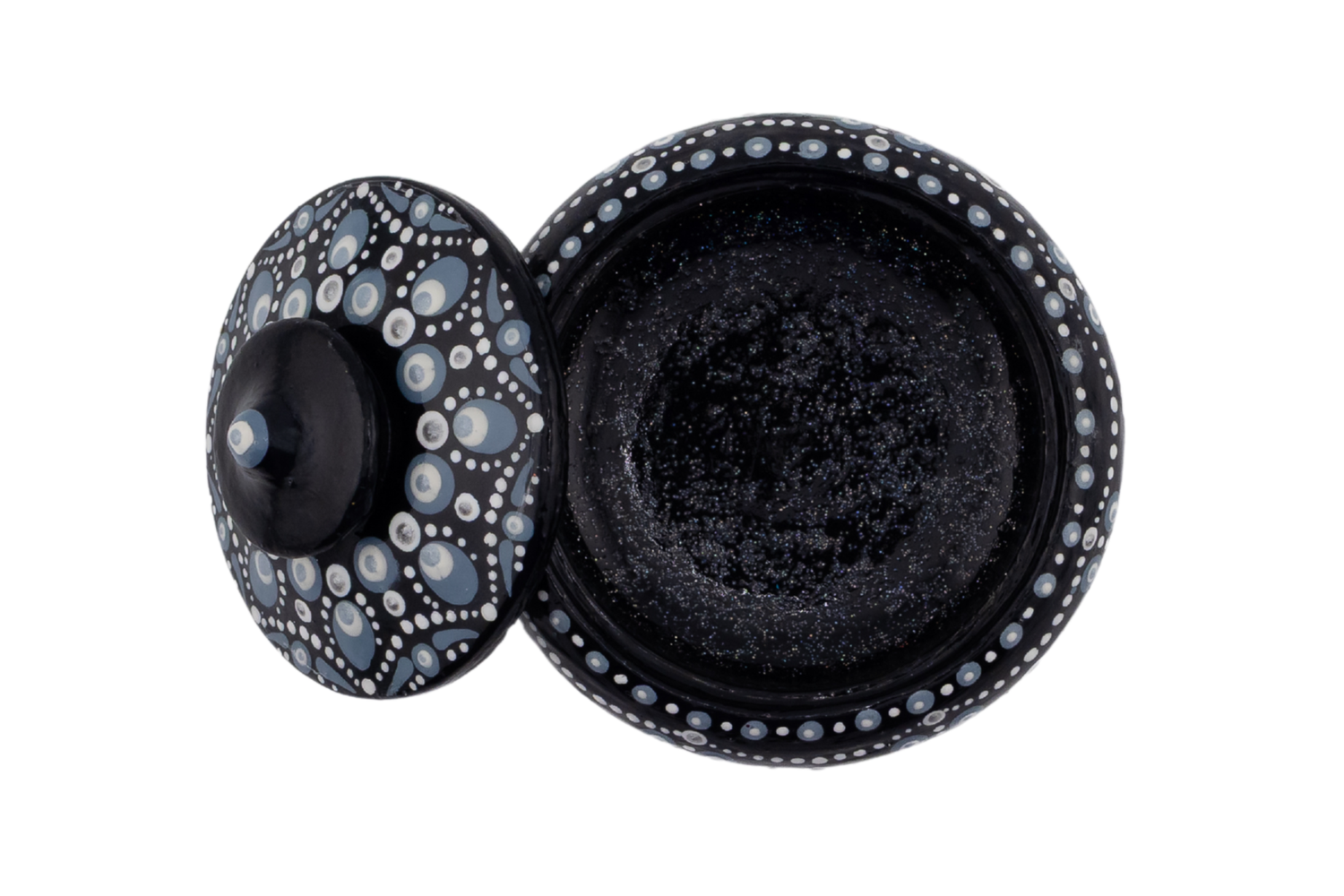Black decorative lidded bowl with intricate silver dot pattern, open to reveal dark interior, handcrafted art piece.