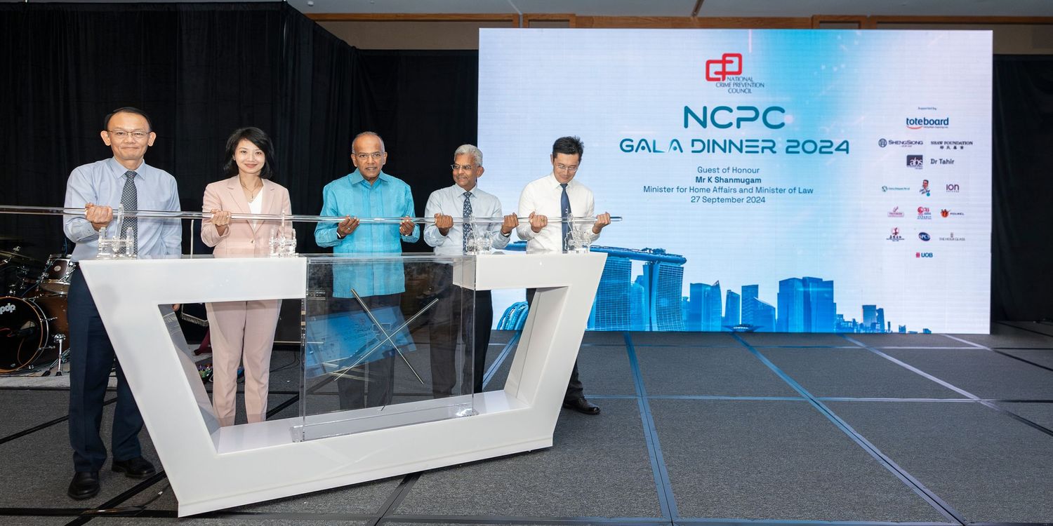 NCPC Gala Dinner 2024 event with guests on stage during an official ceremony in Singapore.