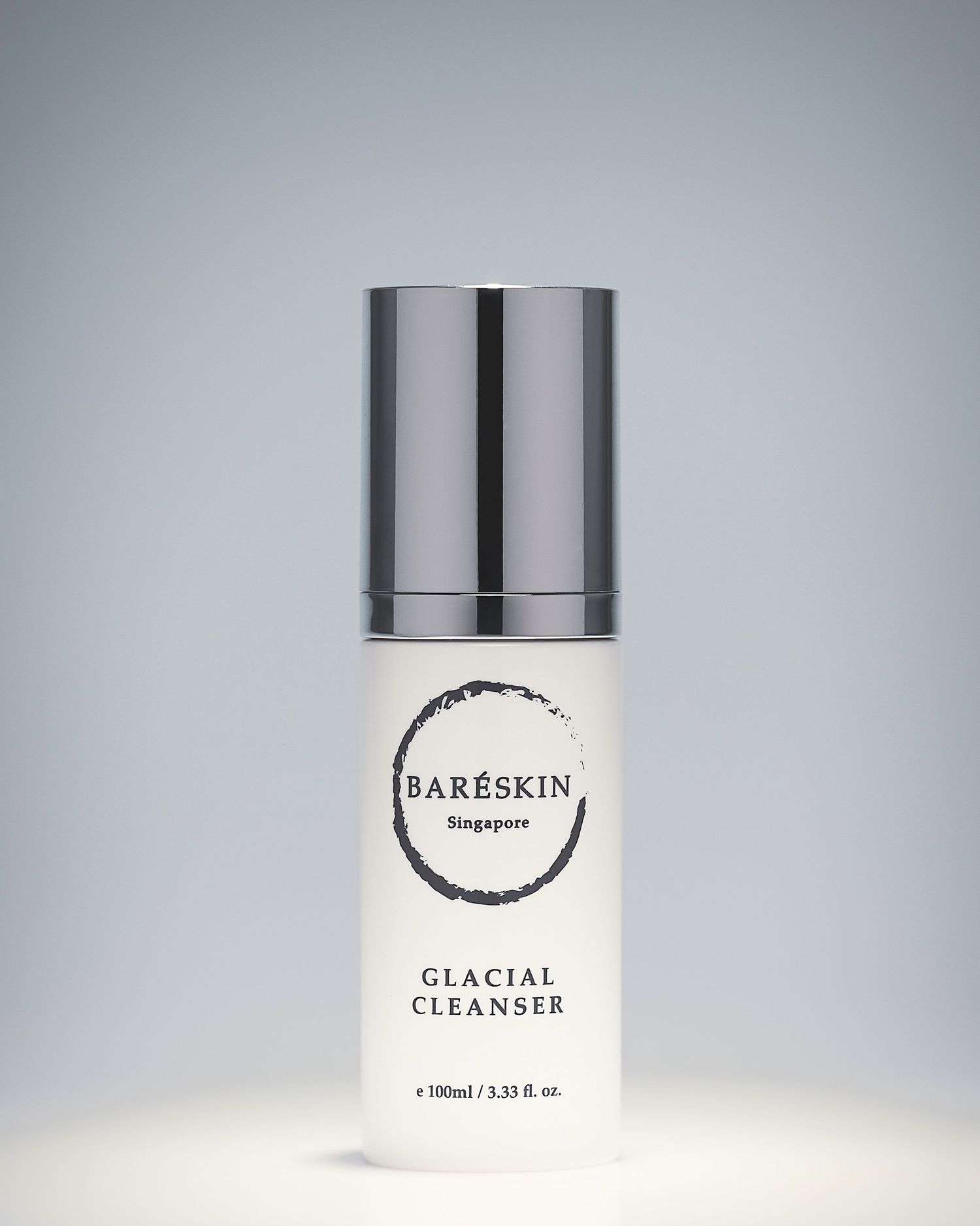 Baréskin Singapore Glacial Cleanser in a sleek white 100ml pump bottle with a silver cap on a light background.