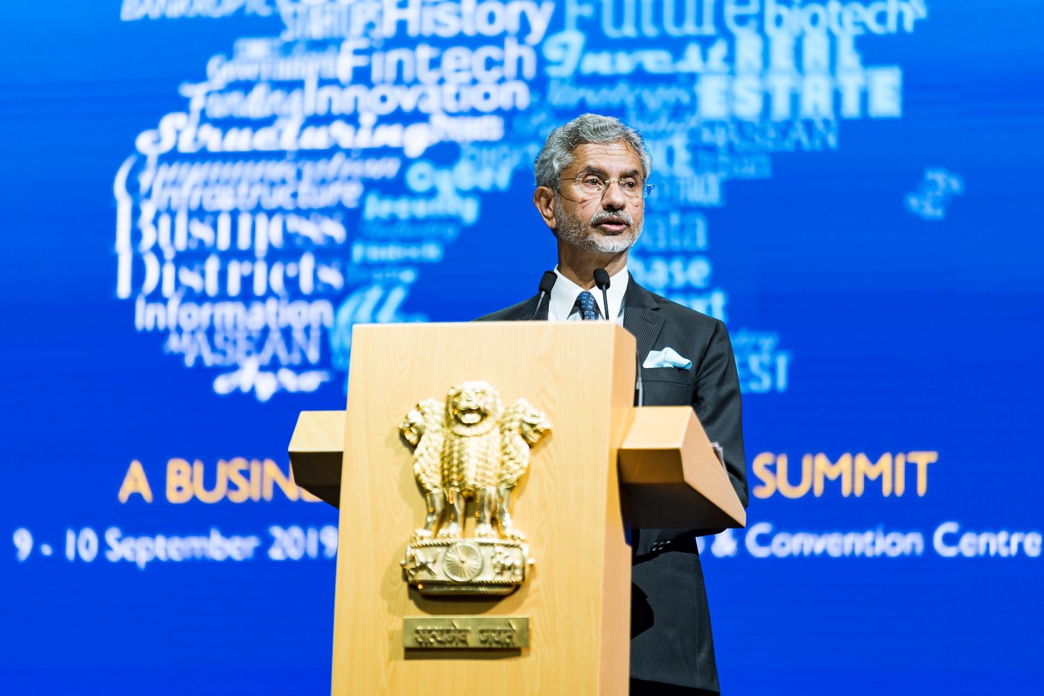 A speaker addresses attendees at the India-ASEAN Business Summit 2019 at a Singapore Convention Centre podium.