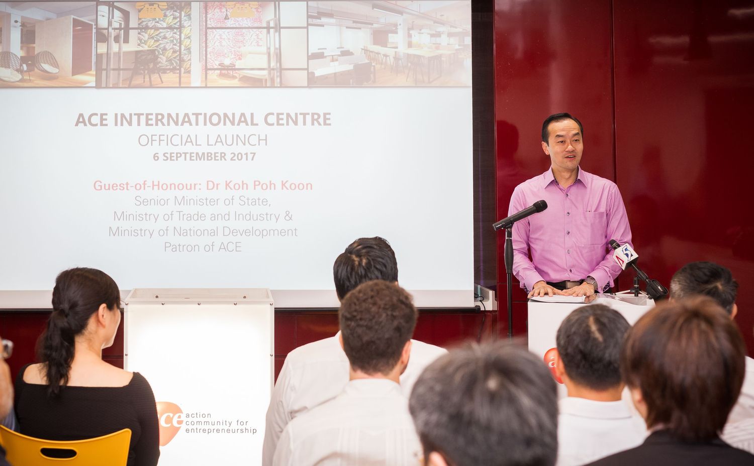 Official launch of ACE International Centre with guest speaker at podium, September 2017.