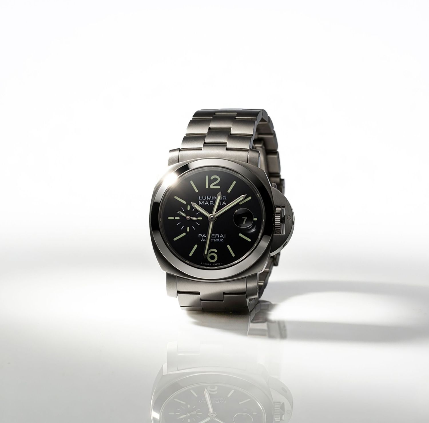 Panerai Luminor stainless steel chronograph watch with black dial and bracelet on white background.