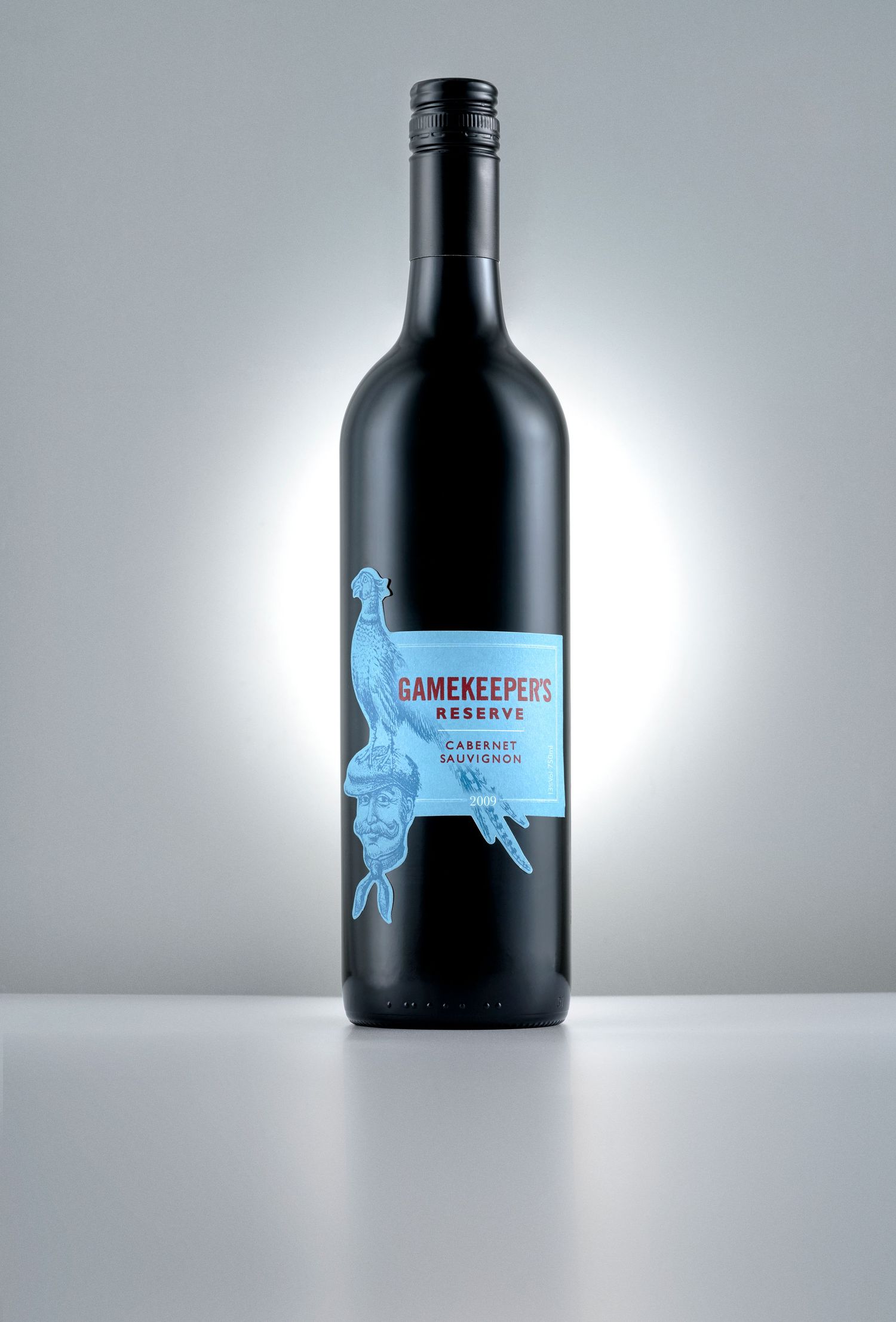 Gamekeeper's Reserve Cabernet Sauvignon wine bottle with blue label featuring a gamekeeper illustration.