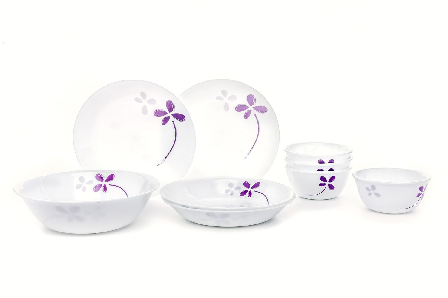 White opal dinnerware set with purple floral design including plates, bowls, and cups on white background.