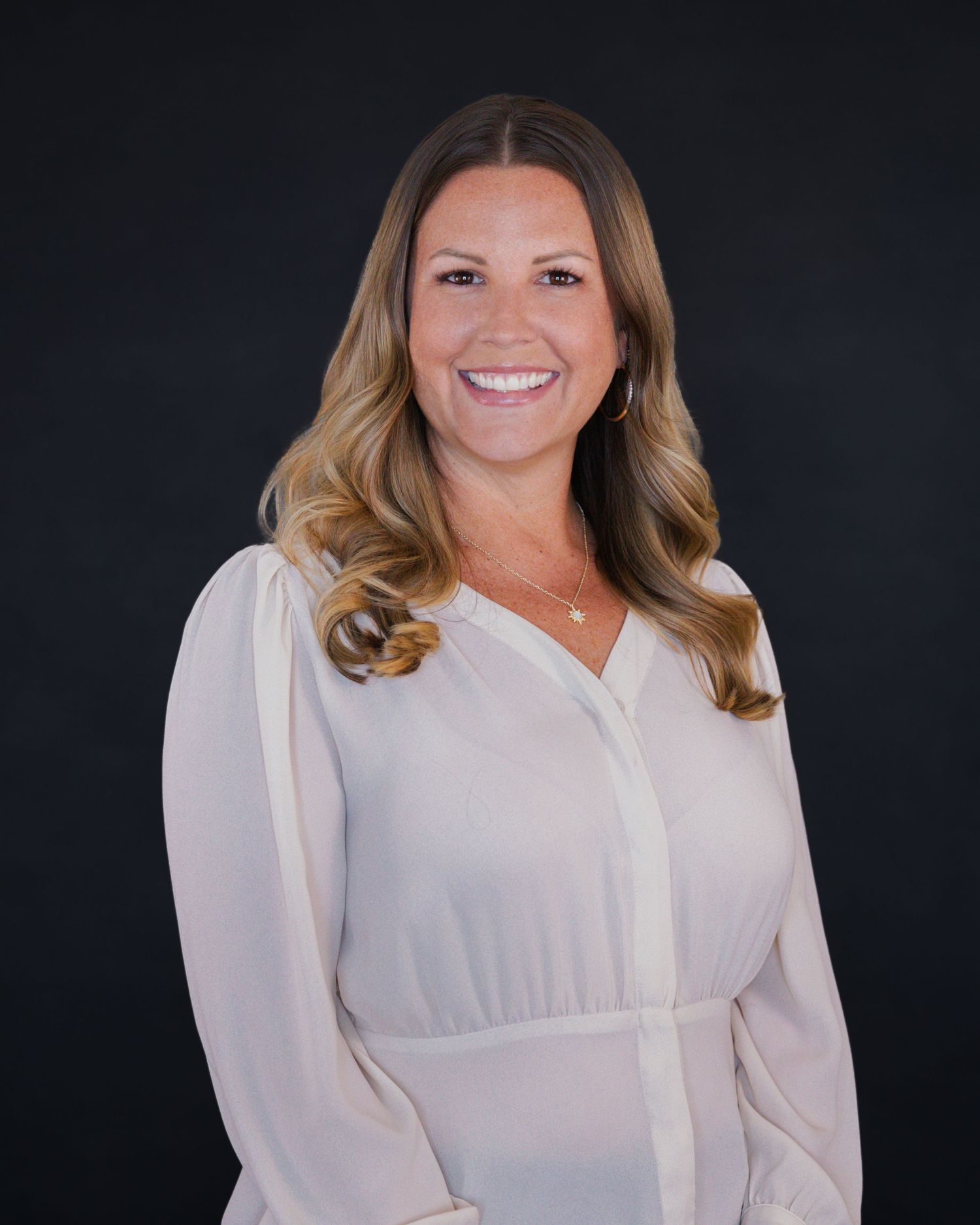 Portrait series showing person in white blouse against dark studio background.