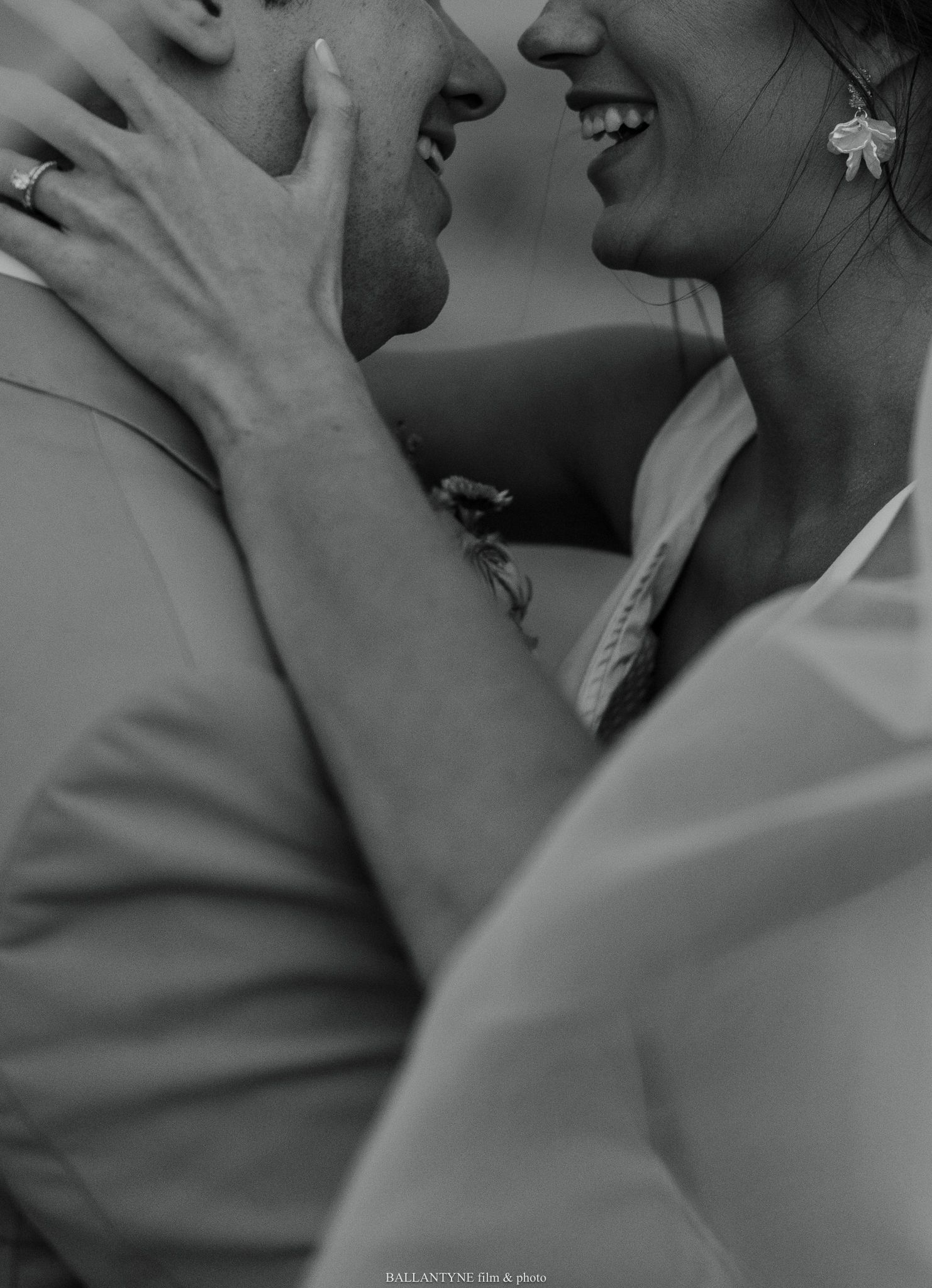 Intimate close-up black and white shots of a couple sharing tender moments.