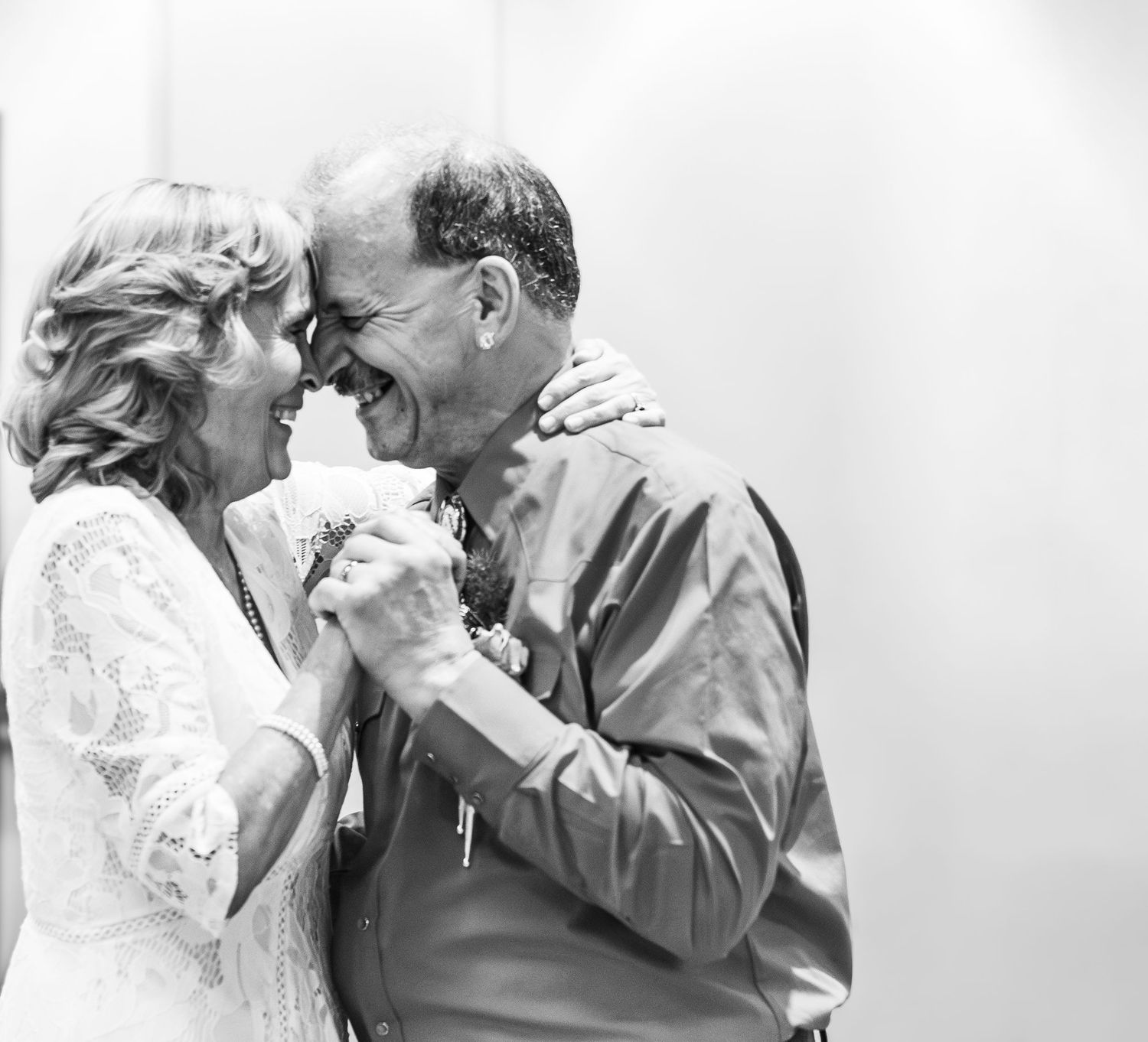 couple smiling landscape wedding black and white forehead to forehead