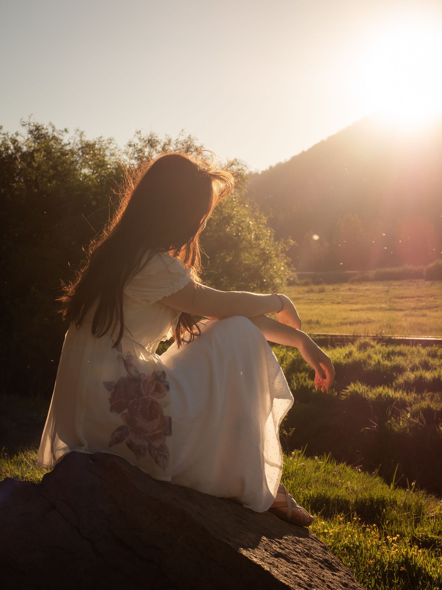 portrait sunset woman in dress green nature background