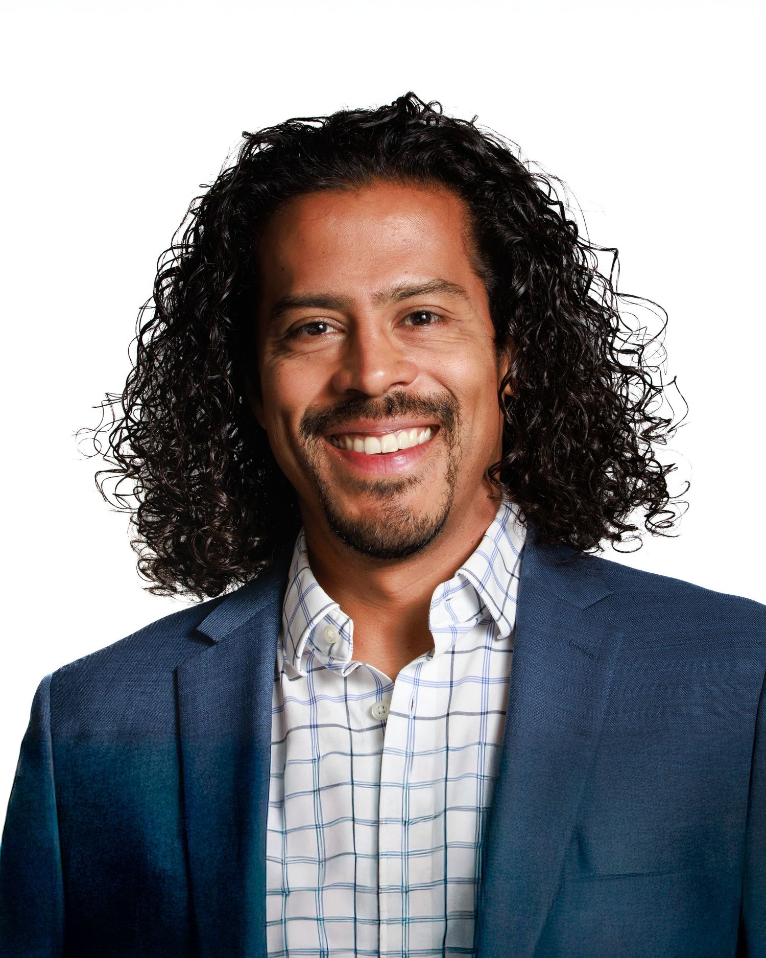 portrait corporate head shot man smiling suit, curly hair