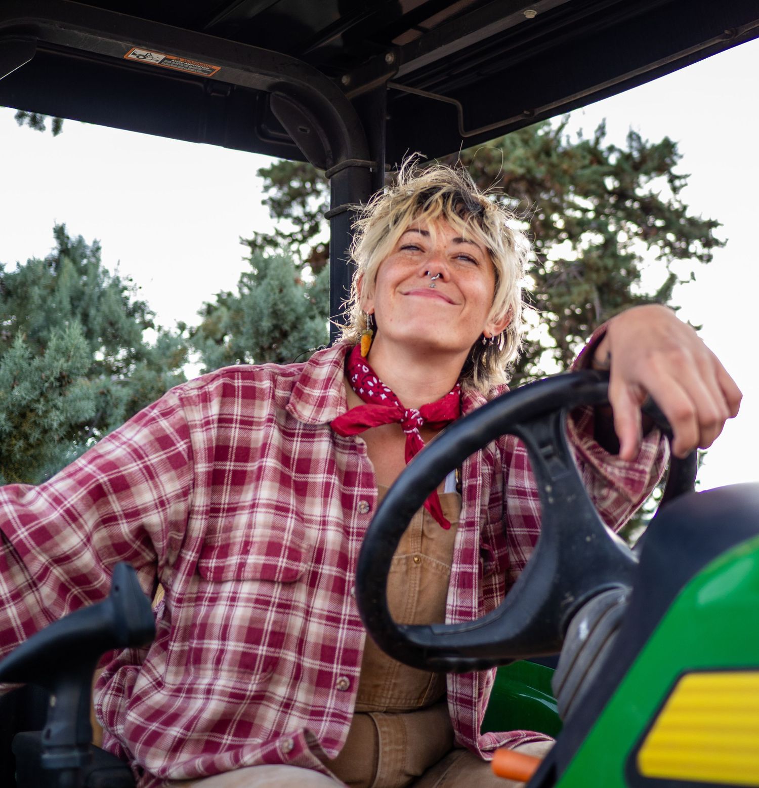 portrait farmer hand on steering wheel smiling tractor photo
