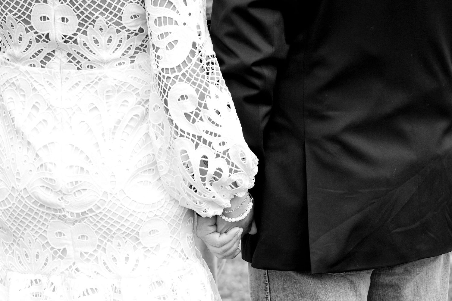 Artistic black and white detail shots of wedding dress lace and formal attire.