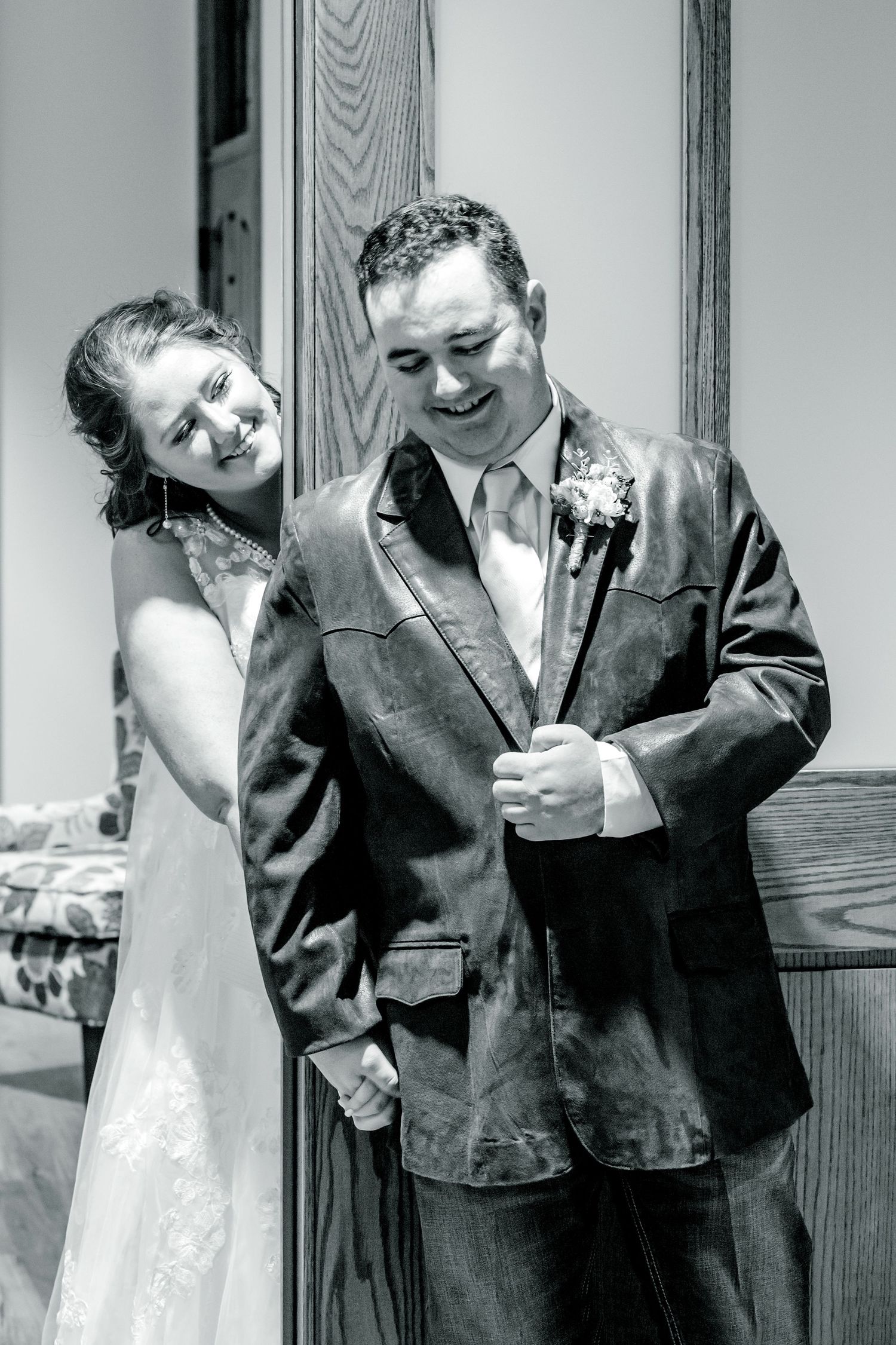 Black and white candid shots of a couple sharing intimate moments during their wedding ceremony.
