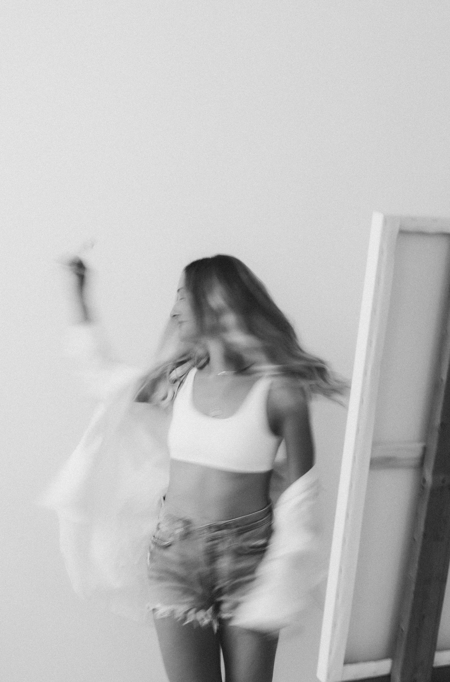 Black and white motion series capturing movement in studio setting.