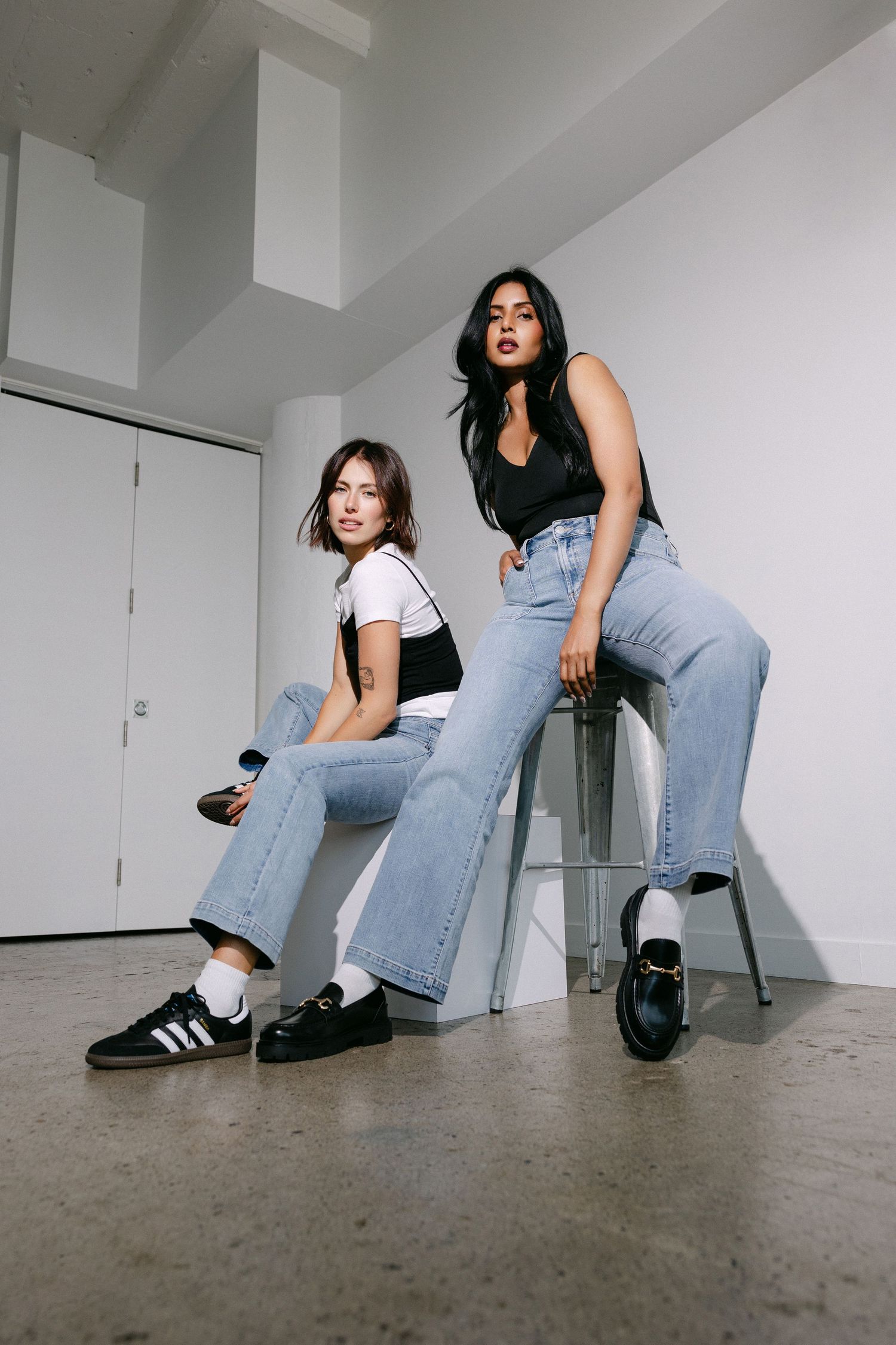 Urban style photoshoot sequence showcasing relaxed poses in denim and sneakers.